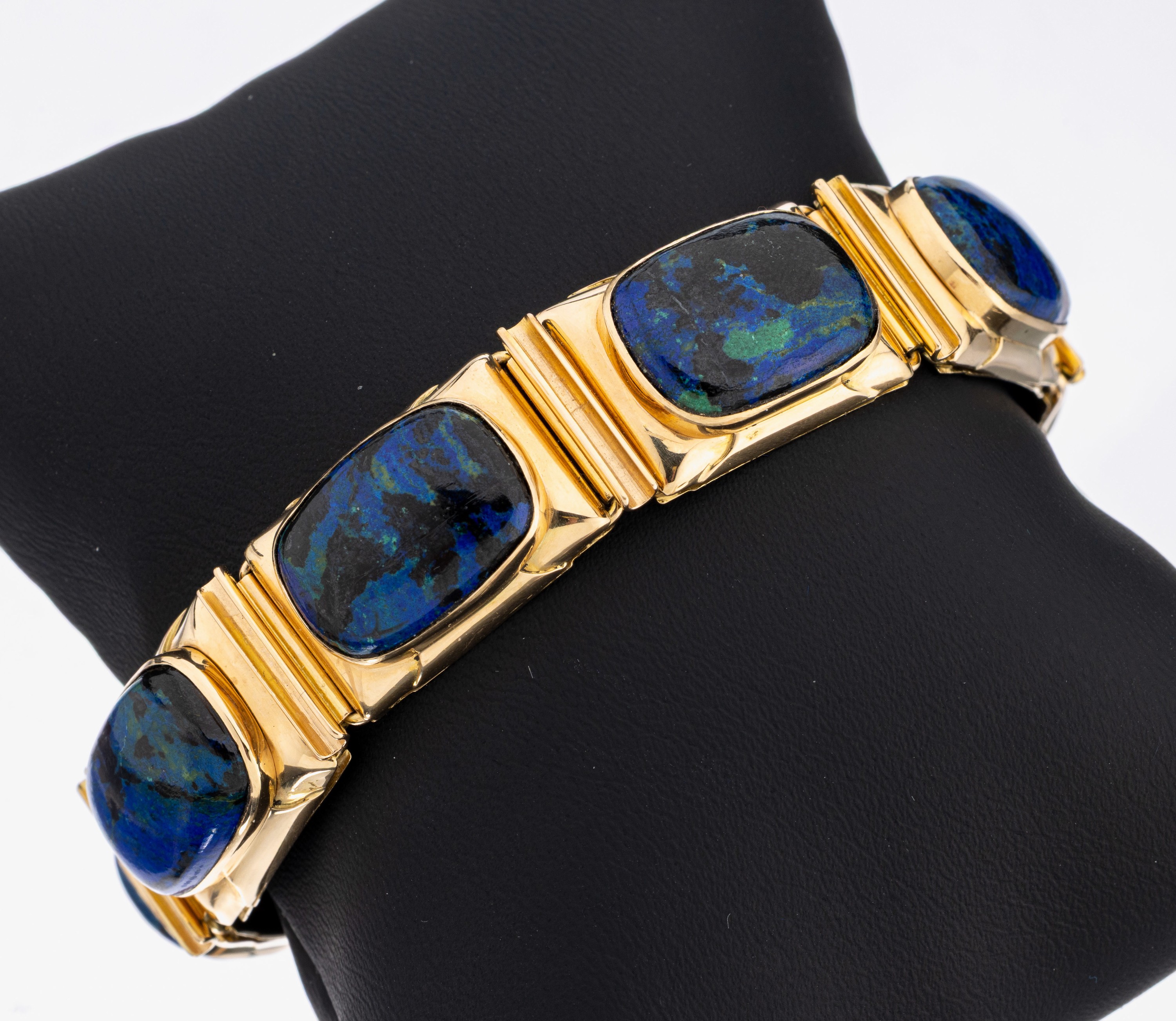 14 kt Gold Chrysokoll-Armband, GG 585/000, 7 rechteckige Glieder mit jeweils 1 ovalen Chrysokoll-Cabochon, L. ca. 17 cm, Kastenschloss mit ...
