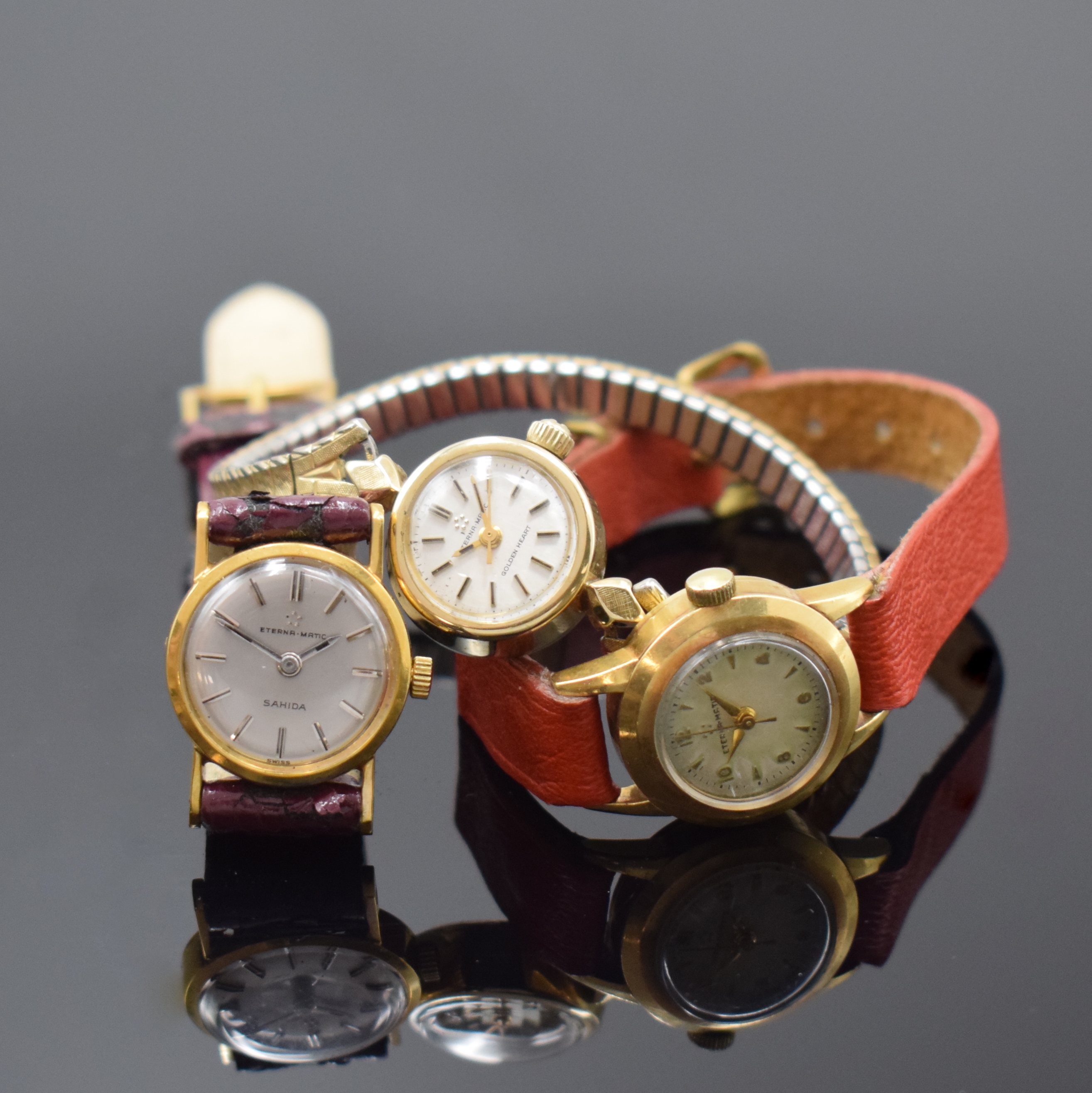 Konvolut: 3 Eterna-Matic Armbanduhren in Gold, Schweiz / USA um 1960, 2 x GG 750/000, 1 X GG 585/000, 1 x bez. Golden Heart an verg. Flexband mit ...