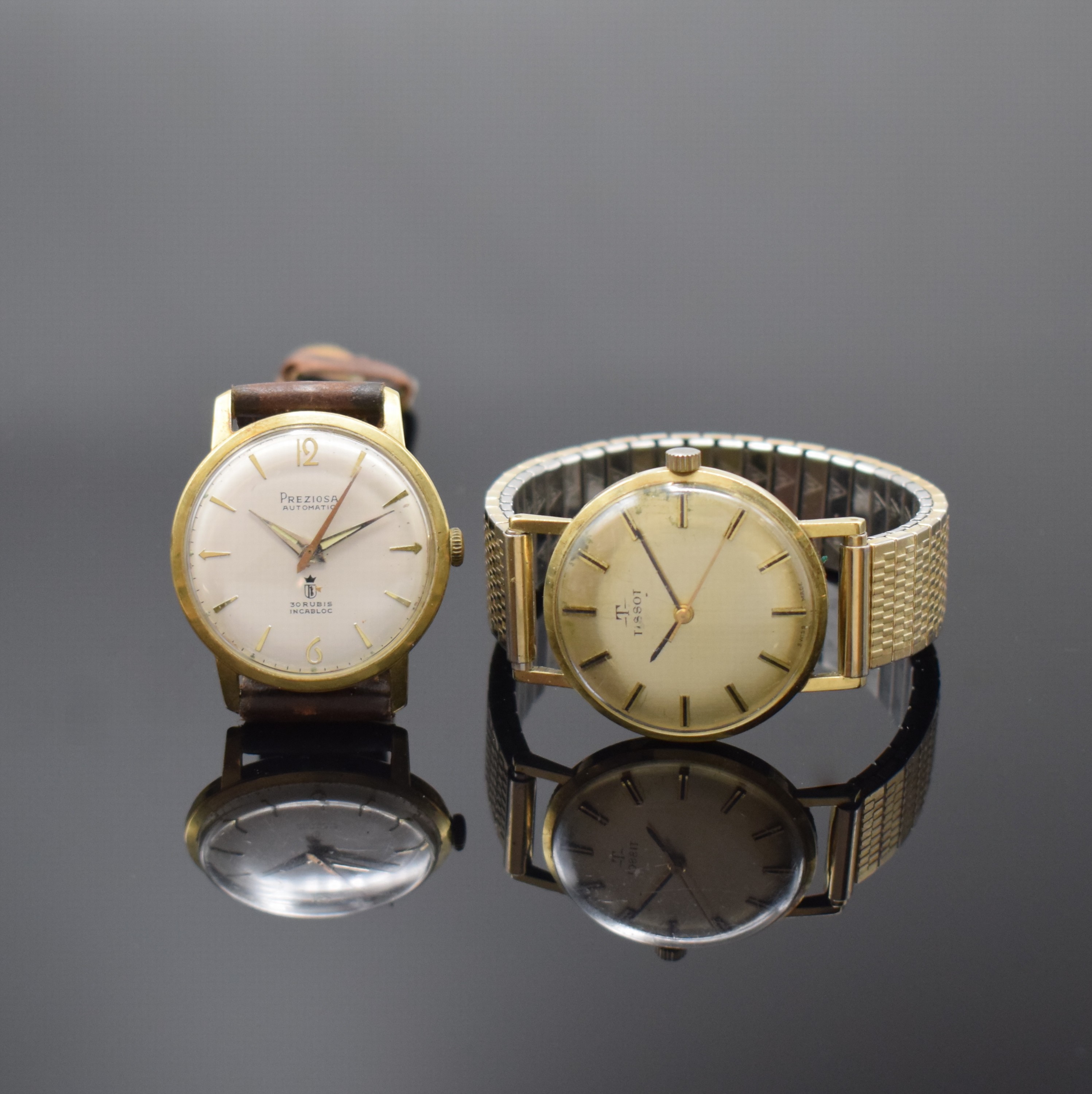 Konvolut 2 Armbanduhren in GG 585/000 Schweiz um 1970, Automatik/Handaufzug, 2-tlg. Geh., Böden aufgedr., 1) TISSOT, Widmungsgrav. auf Boden, gold. ...