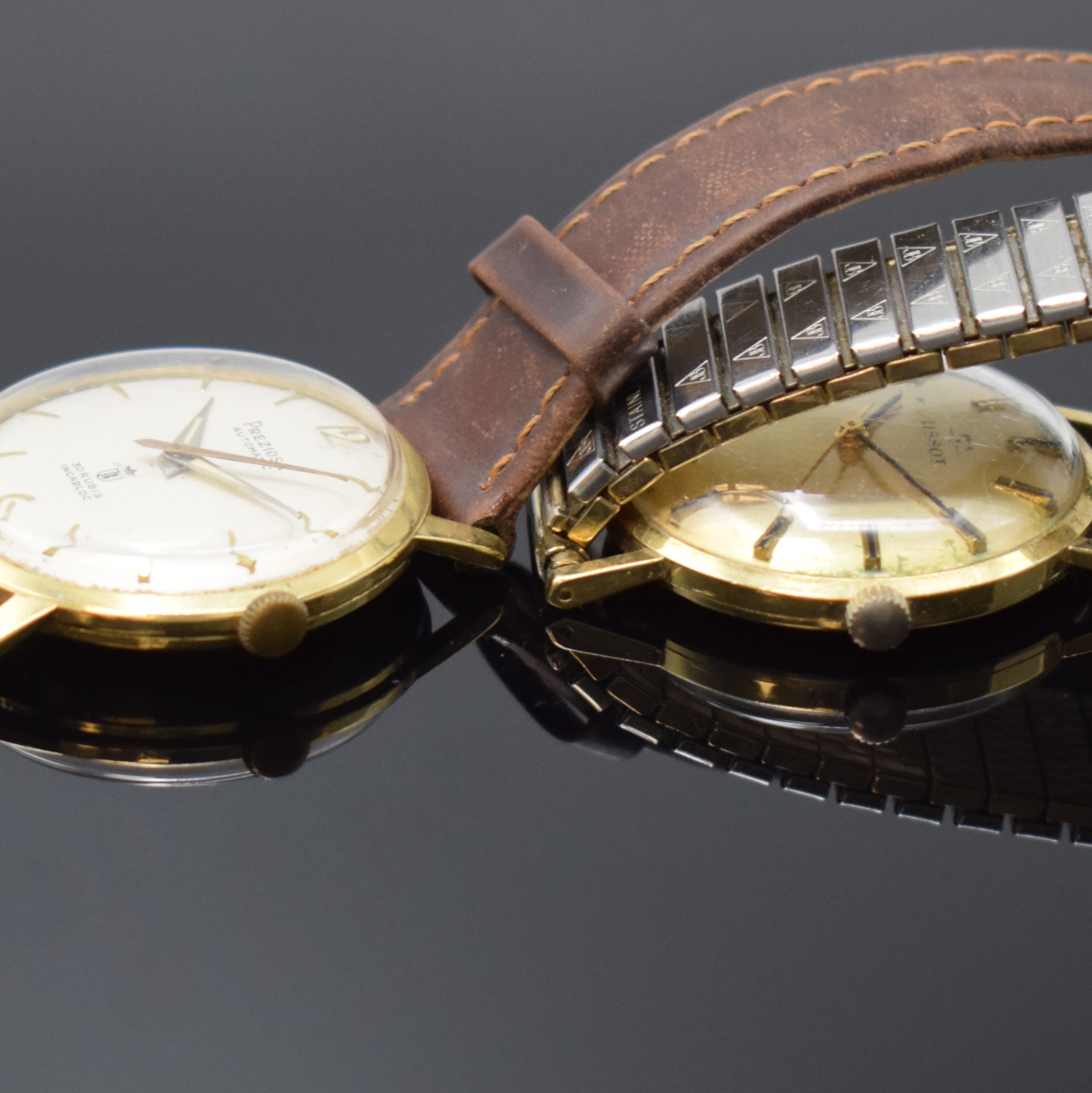 Detail c: Konvolut 2 Armbanduhren in GG 585/000 Schweiz um 1970, Automatik/Handaufzug, 2-tlg. Geh., Böden aufgedr., 1) TISSOT, Widmungsgrav. auf Boden, gold. ...