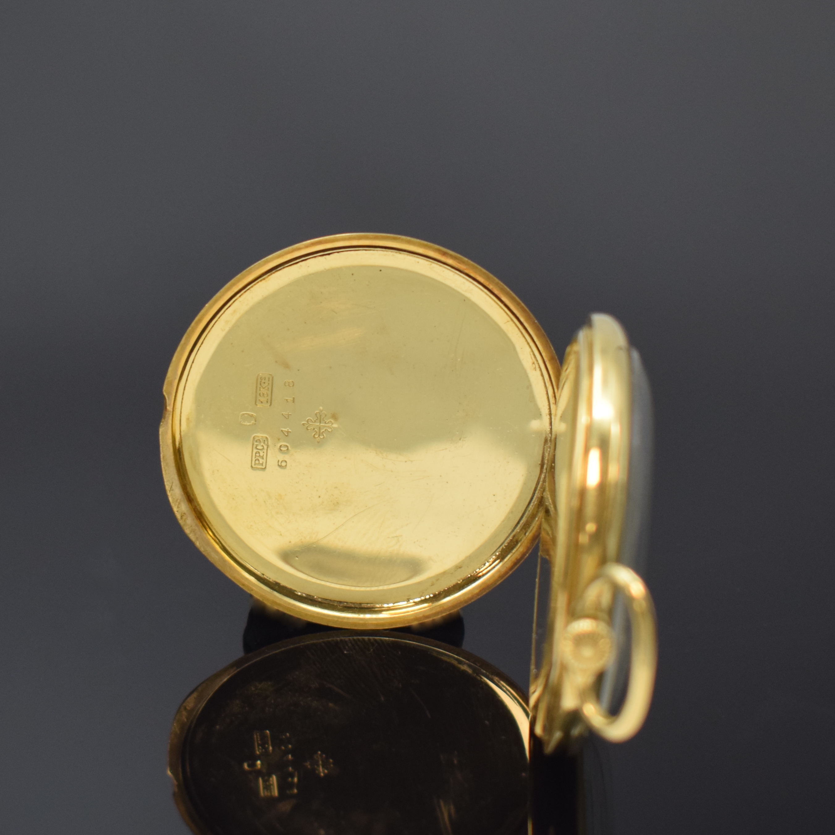 Detail b: PATEK PHILIPPE & Cie offene Frackuhr in GG 750/000, Schweiz um 1925, glattes Geh. dell. m. gekürztem Scharnier, matt-silb. Zifferbl. pat., aufges. ...