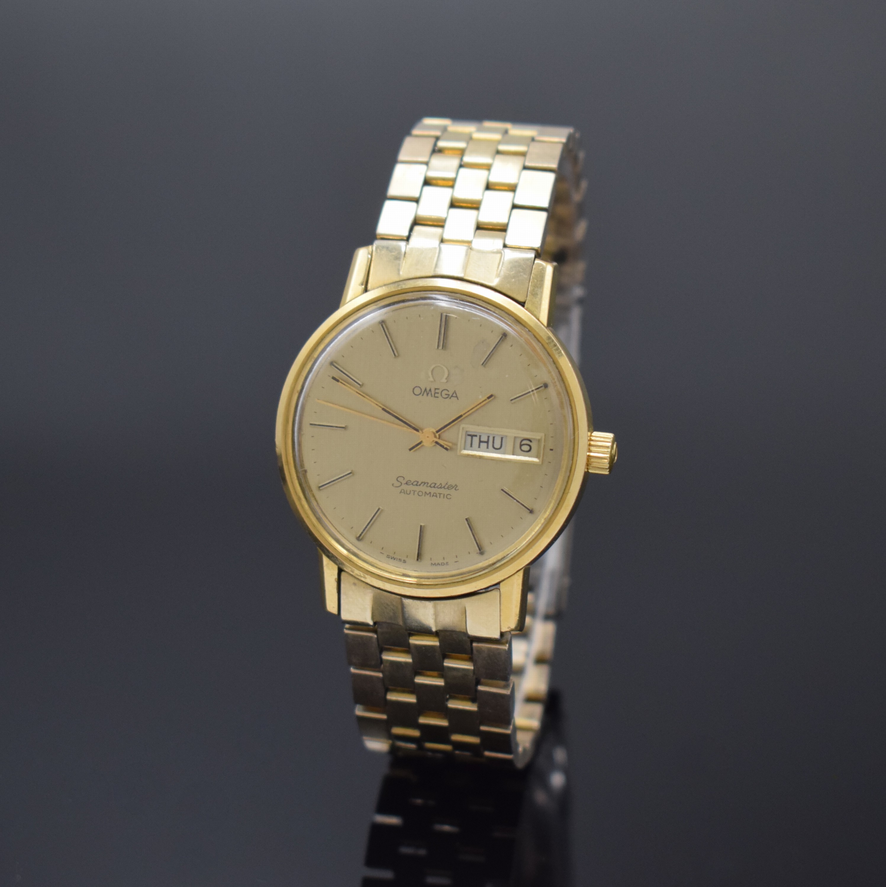 OMEGA Seamaster vergoldete Armbanduhr Referenz 166.0209, Schweiz um 1979, Automatik, orig. verg. Gliederband m. Faltschl., Boden aufgedr., ...