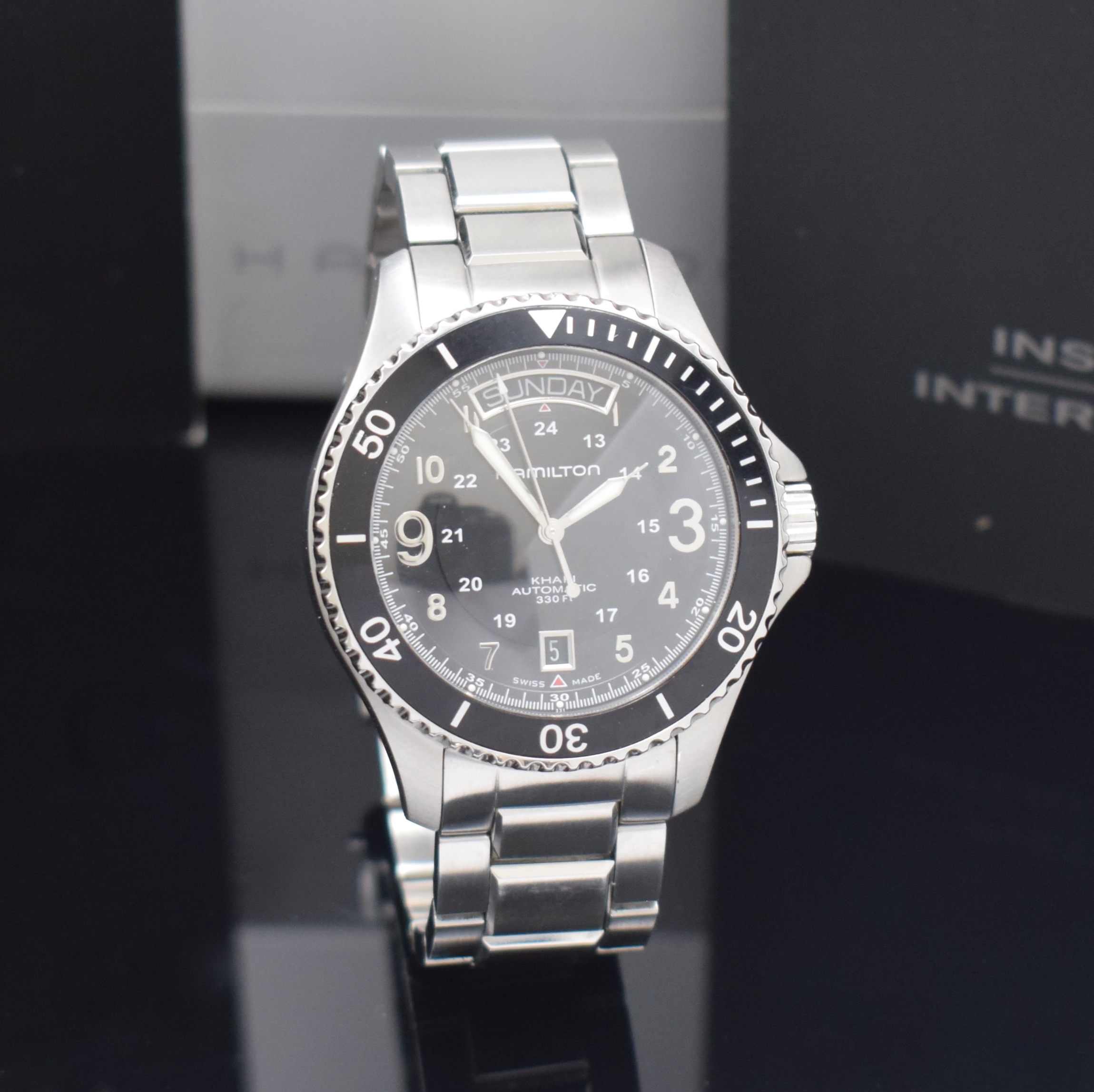 Detail b: HAMILTON Khaki Herrenarmbanduhr Referenz H64515133, Schweiz verk. lt. Pap. 10/2011, Automatik, beids. vergl. Edelstahlgeh., Boden u. Krone verschr., ...