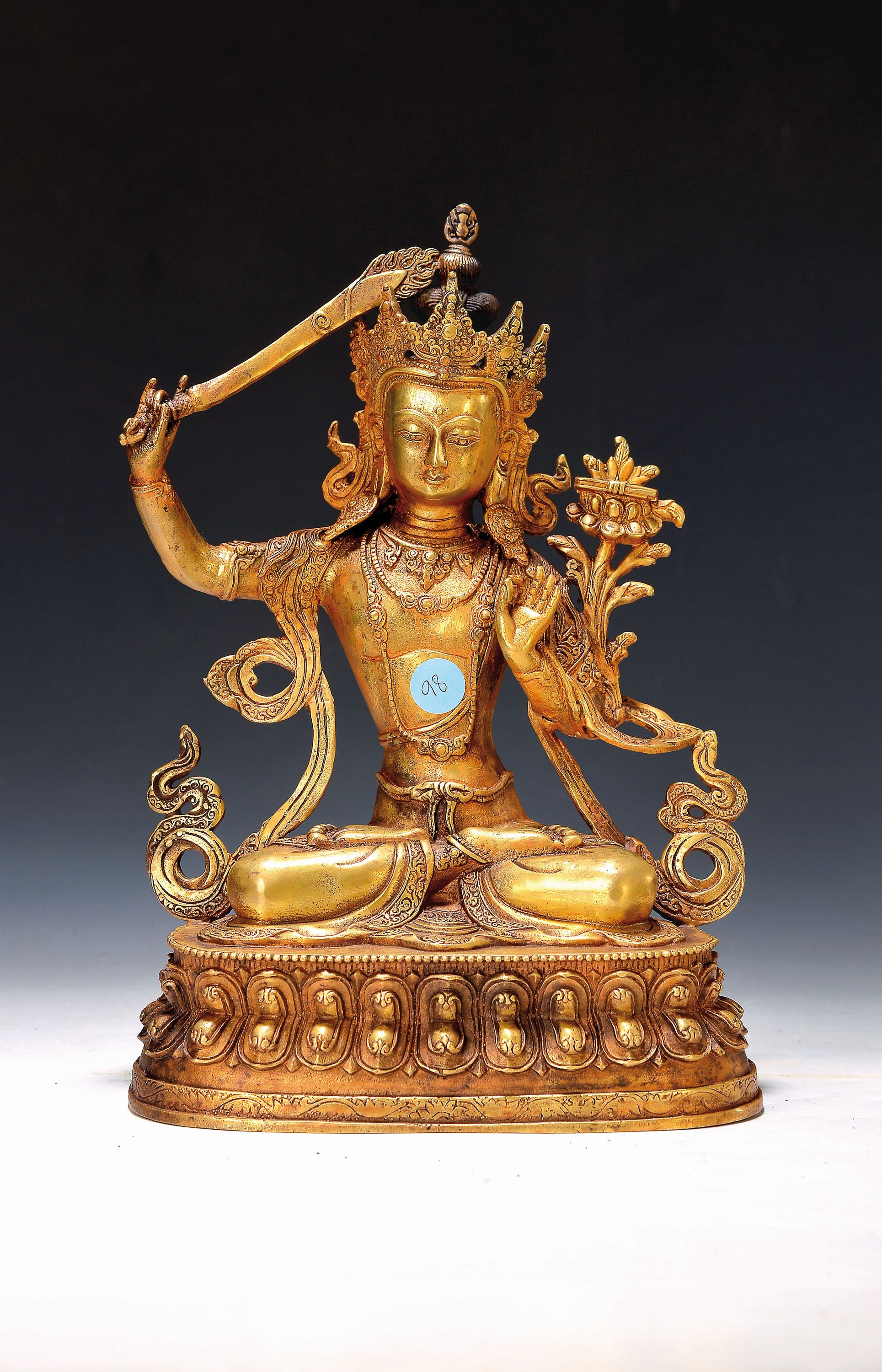 Bodhisattva der Weisheit - Manjushri, Nepal, 20.Jh., Kupferlegierung, vergoldet, mit Flammenschwert u. Buch, Prajnaparamita, H.ca.31 cm