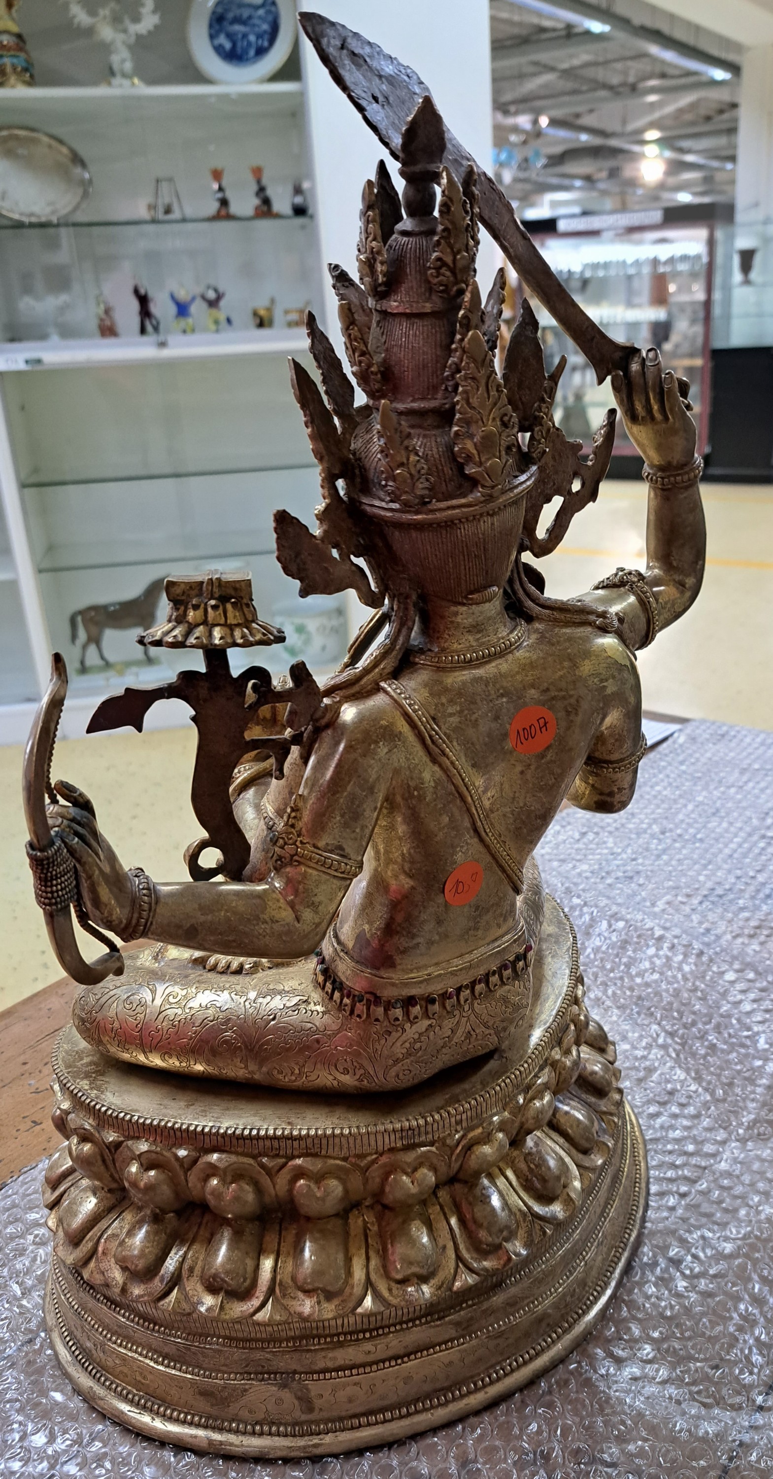 Detail c: Bodhisattva der Weisheit - Manjushri, Nepal, wohl um 1900, Kupferlegierung, vergoldet, H. 61 cm