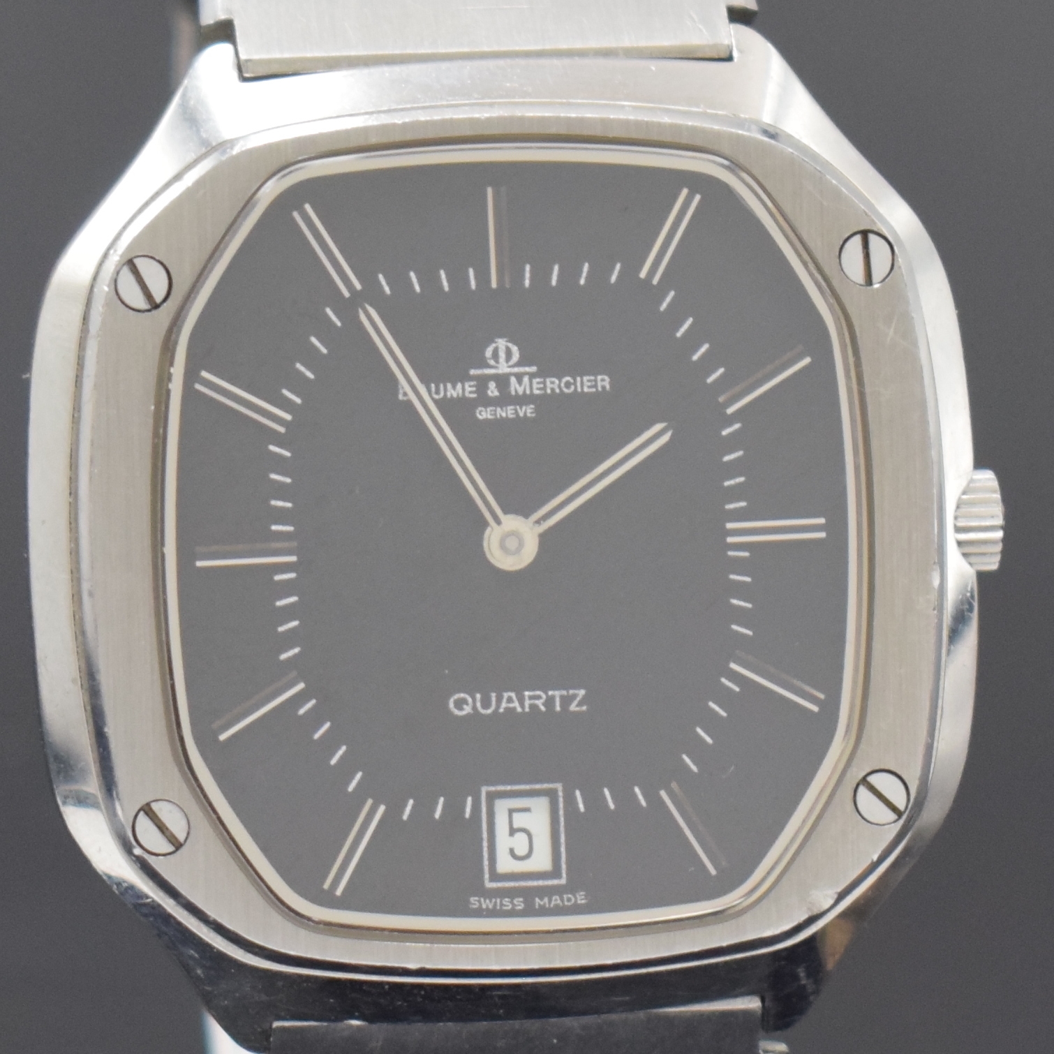 Detail c: BAUME & MERCIER Armbanduhr Referenz 4100, quarz, Schweiz um 1985, Edelstahlgeh. inkl. Gliederband m. Faltschl., Boden aufgedr., schwarzes Zifferbl., ...