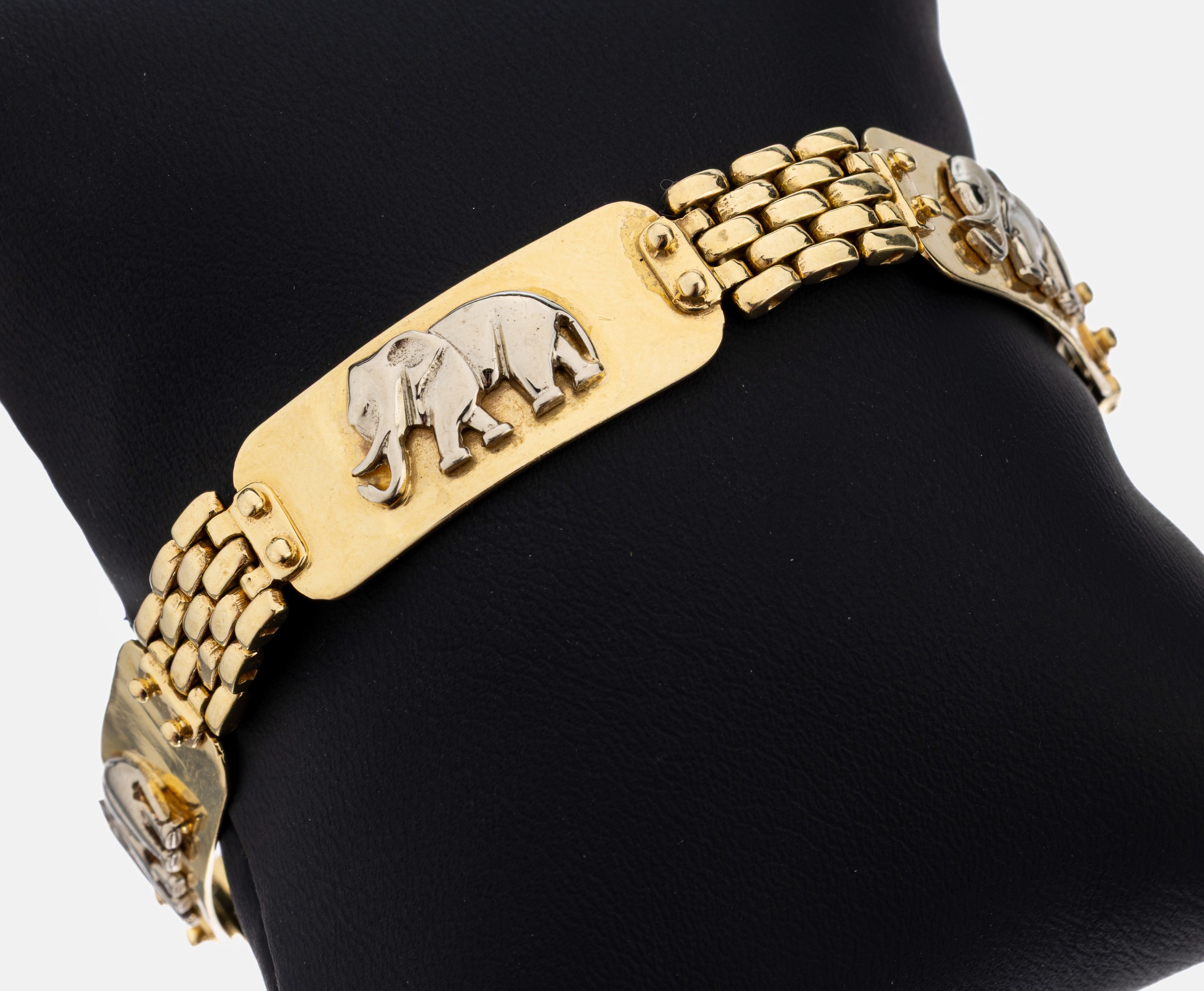 14 kt Gold Armband "Elefant", GG/WG 585/000, 4 aufgelegte Elefanten in WG, L. ca. 19.5 cm, runde Karabinerschließe, ca. 29.9 g