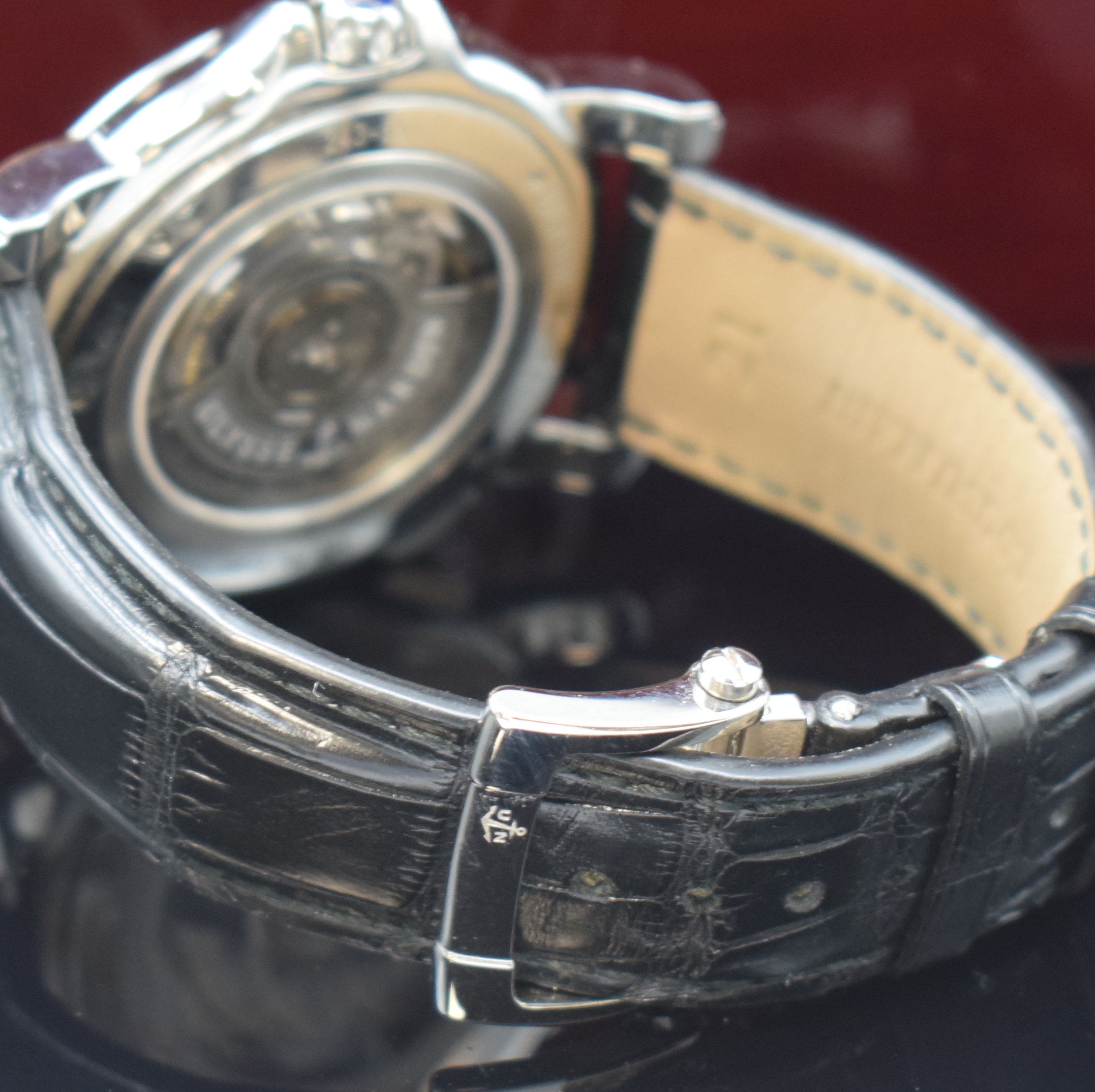 Detail b: ULYSSE NARDIN Dual Time Herrenarmbanduhr Referenz 243-55, Schweiz um 2015, Automatik, beids. vergl. Edelstahlgeh., Boden 6-fach verschr., Krone ...