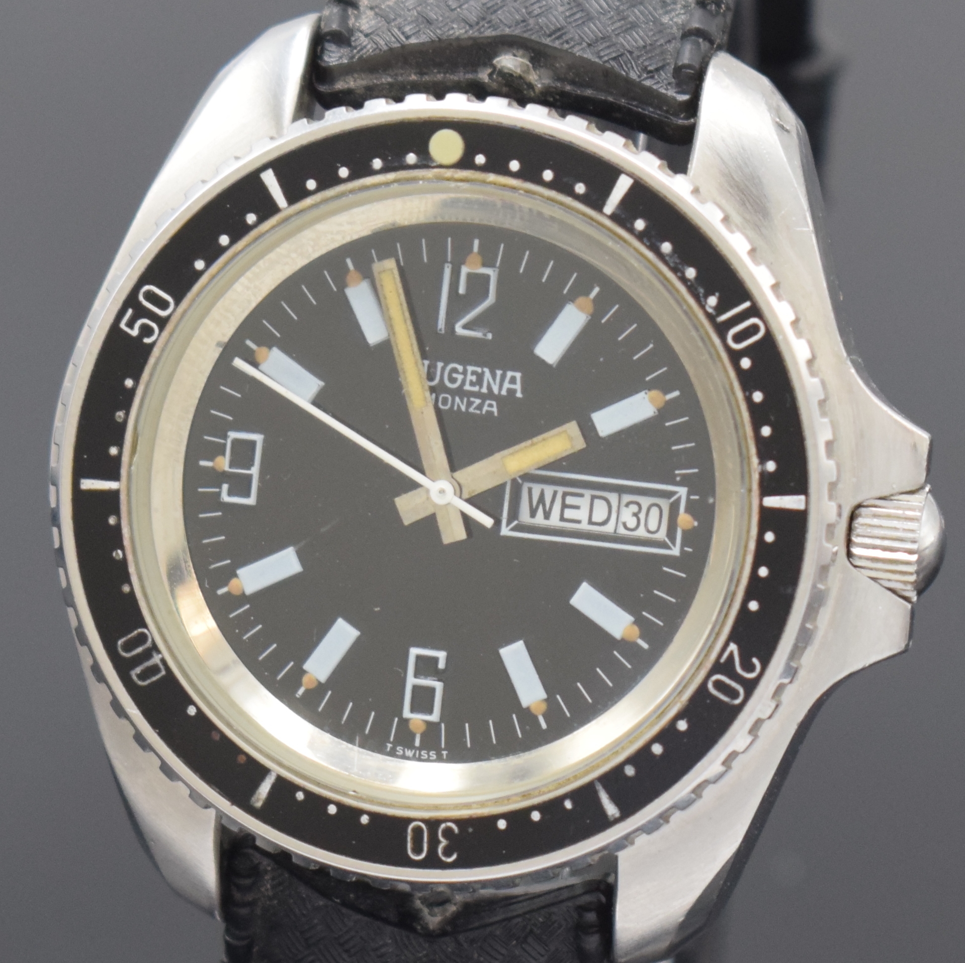 Detail a: DUGENA Monza Herrenarmbanduhr in Stahl, Schweiz um 1970, Automatik, Boden u. Krone verschr., Lünette m. 60er Teilung eins. drehb., schwarzes ...