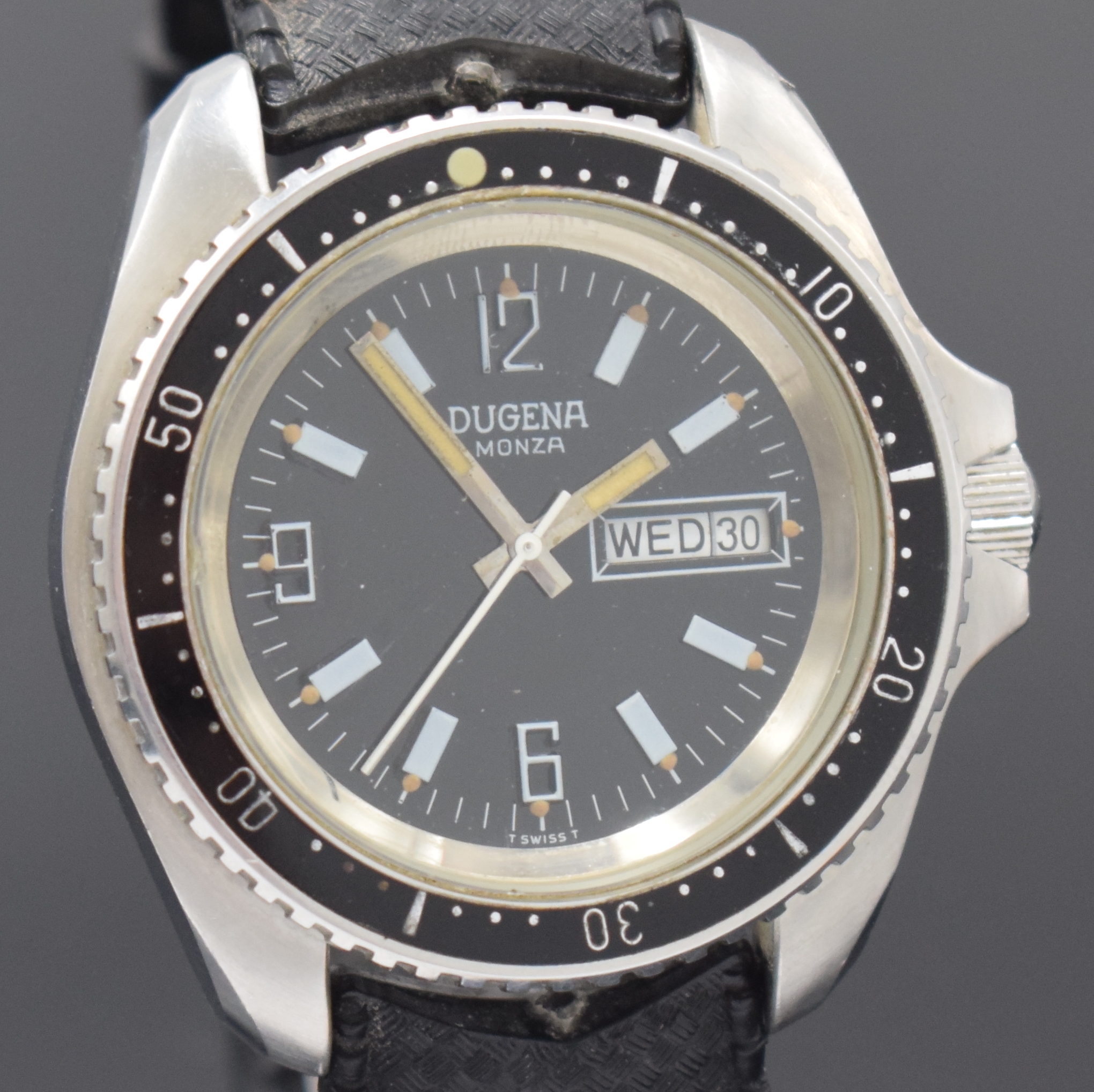 Detail c: DUGENA Monza Herrenarmbanduhr in Stahl, Schweiz um 1970, Automatik, Boden u. Krone verschr., Lünette m. 60er Teilung eins. drehb., schwarzes ...