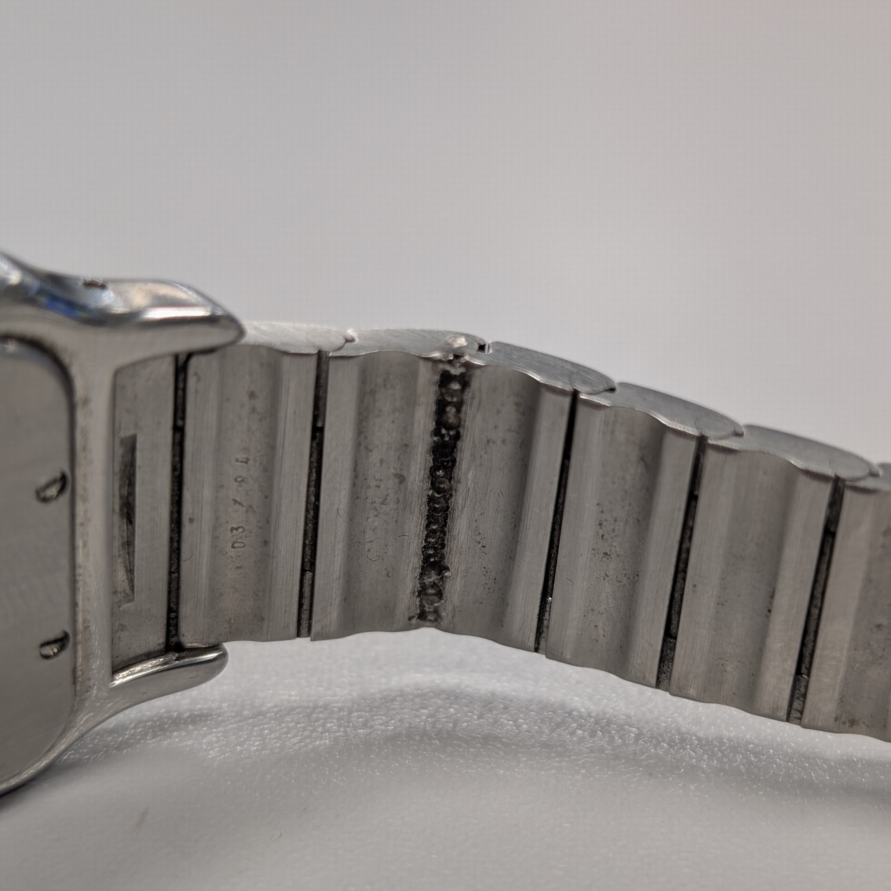 Detail e: CARTIER Armbanduhr Santos Galbee Referenz 187901, Schweiz um 1995, quarz, Edelstahl/Gold kombiniert inkl. Gliederband m. Faltschl., Schmuckkrone, ...