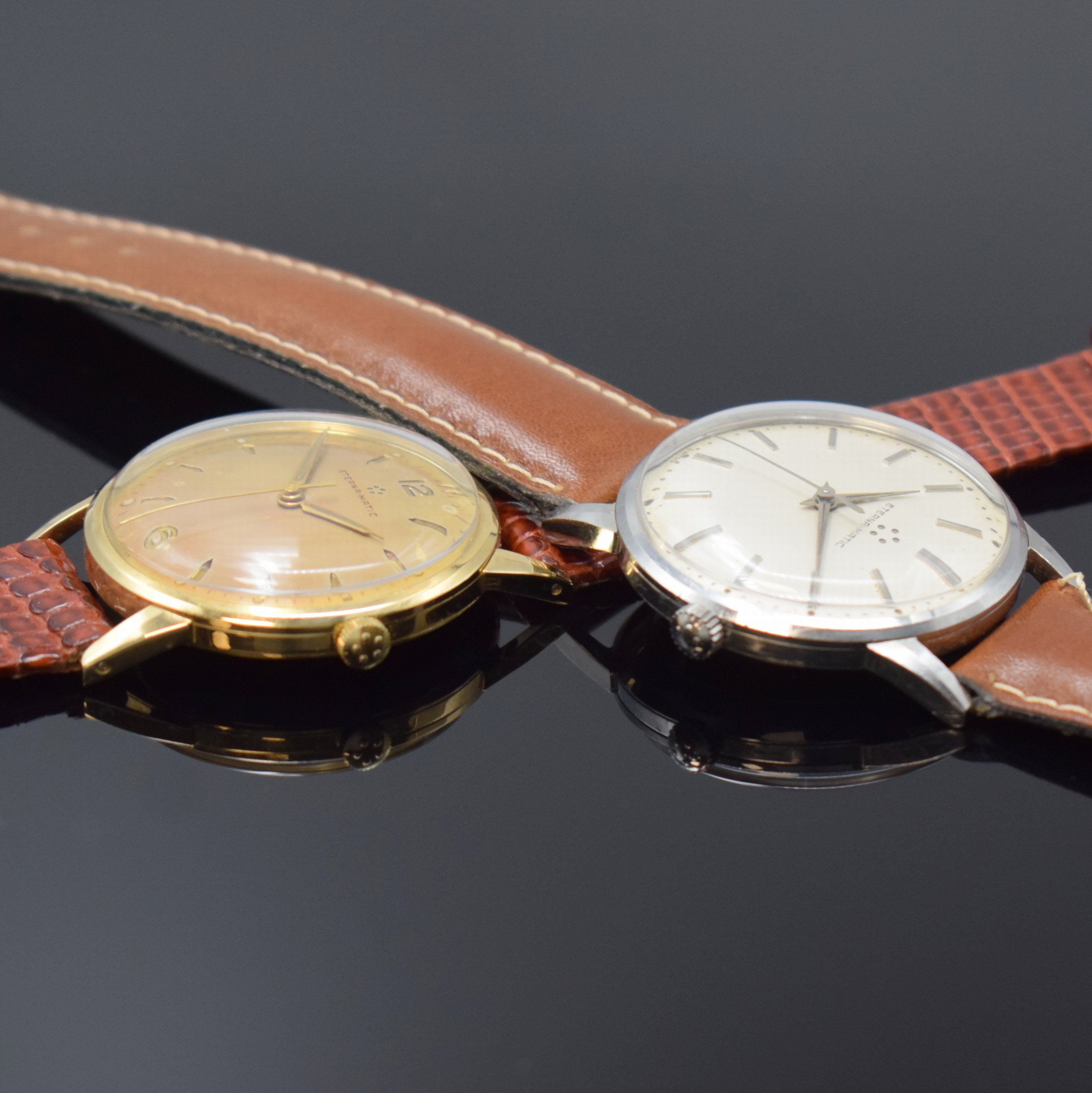 Detail c: ETERNA-MATIC 2 Armbanduhren in GG 585/000 und Stahl, Schweiz um 1955, Böden aufgedr., 1 x gold. Zifferbl. altersbed. pat. und 1 x silb. Zifferbl., ...