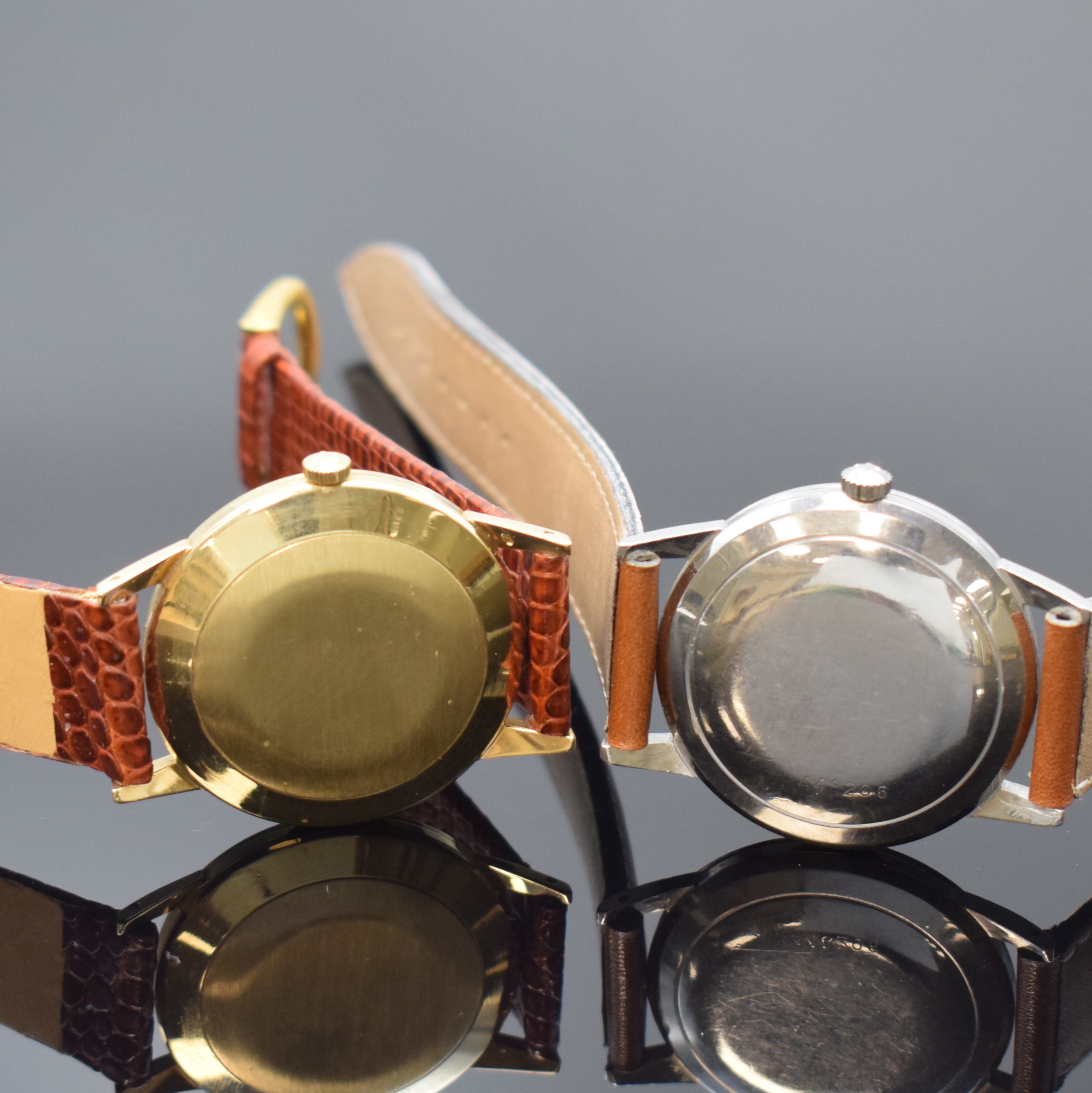 Detail d: ETERNA-MATIC 2 Armbanduhren in GG 585/000 und Stahl, Schweiz um 1955, Böden aufgedr., 1 x gold. Zifferbl. altersbed. pat. und 1 x silb. Zifferbl., ...