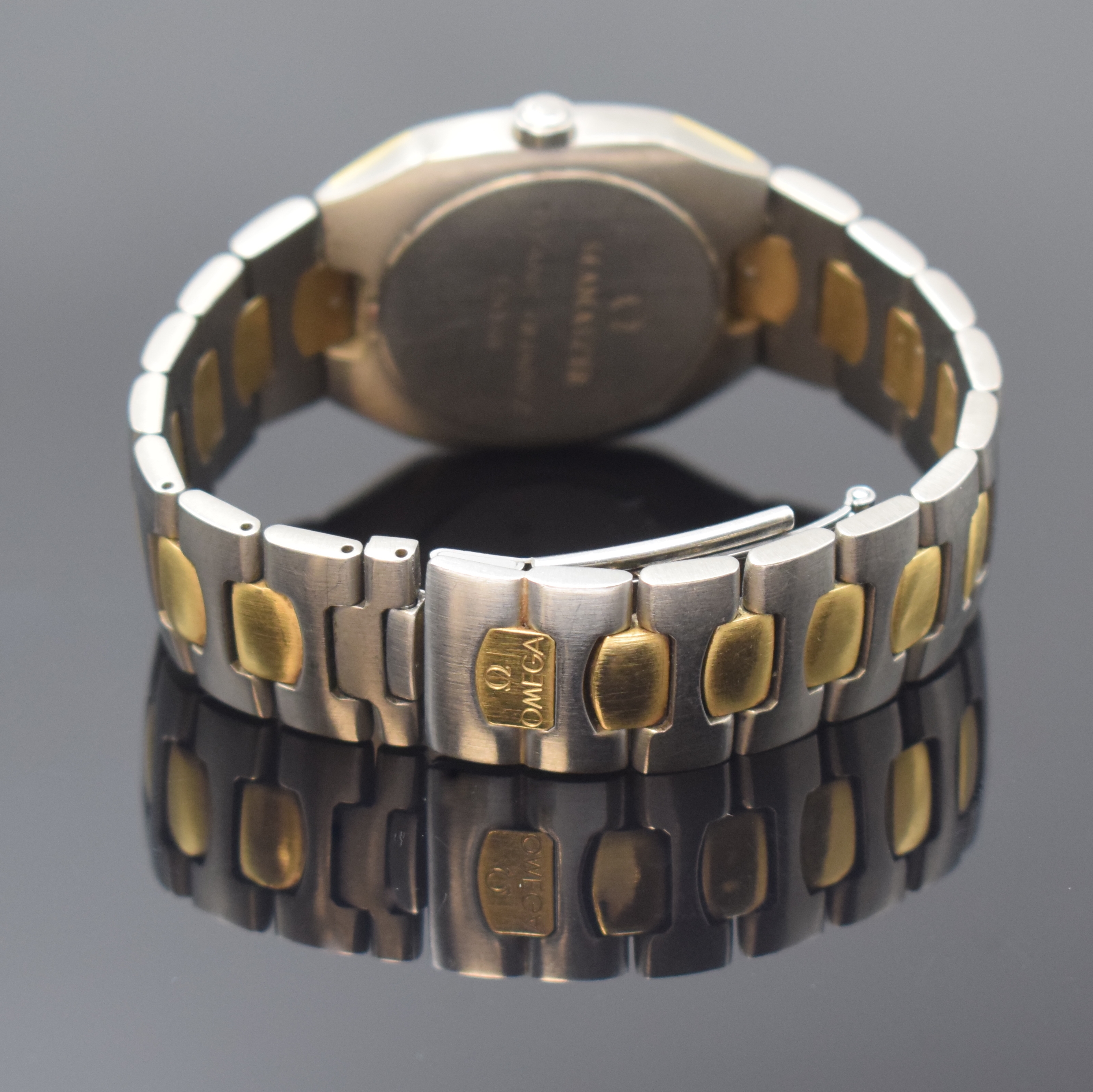 Detail b: OMEGA Seamaster Polaris Armbanduhr in Titan/Gold Referenz 396.1000, Schweiz um 1990, quarz, Krone verschr., Boden aufgedr., intarsierte Lünette ...
