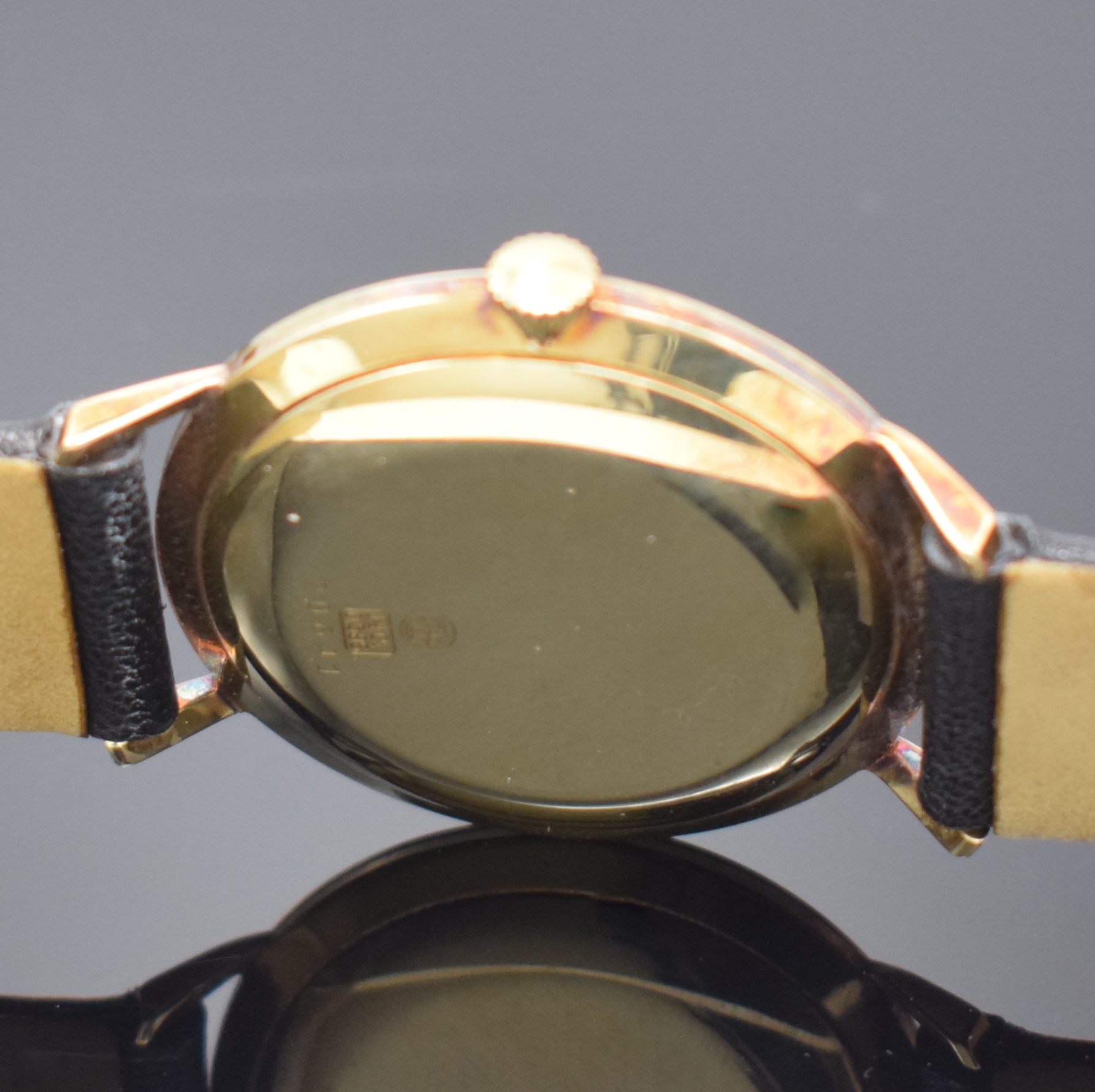 Detail c: JUNGHANS Meister Armbanduhr in GG 585/000, Deutschland um 1960, Handaufzug, Boden u. Glasrand aufgedr., silb. Zifferbl., gold. Ind. u. Zeiger, verg. ...