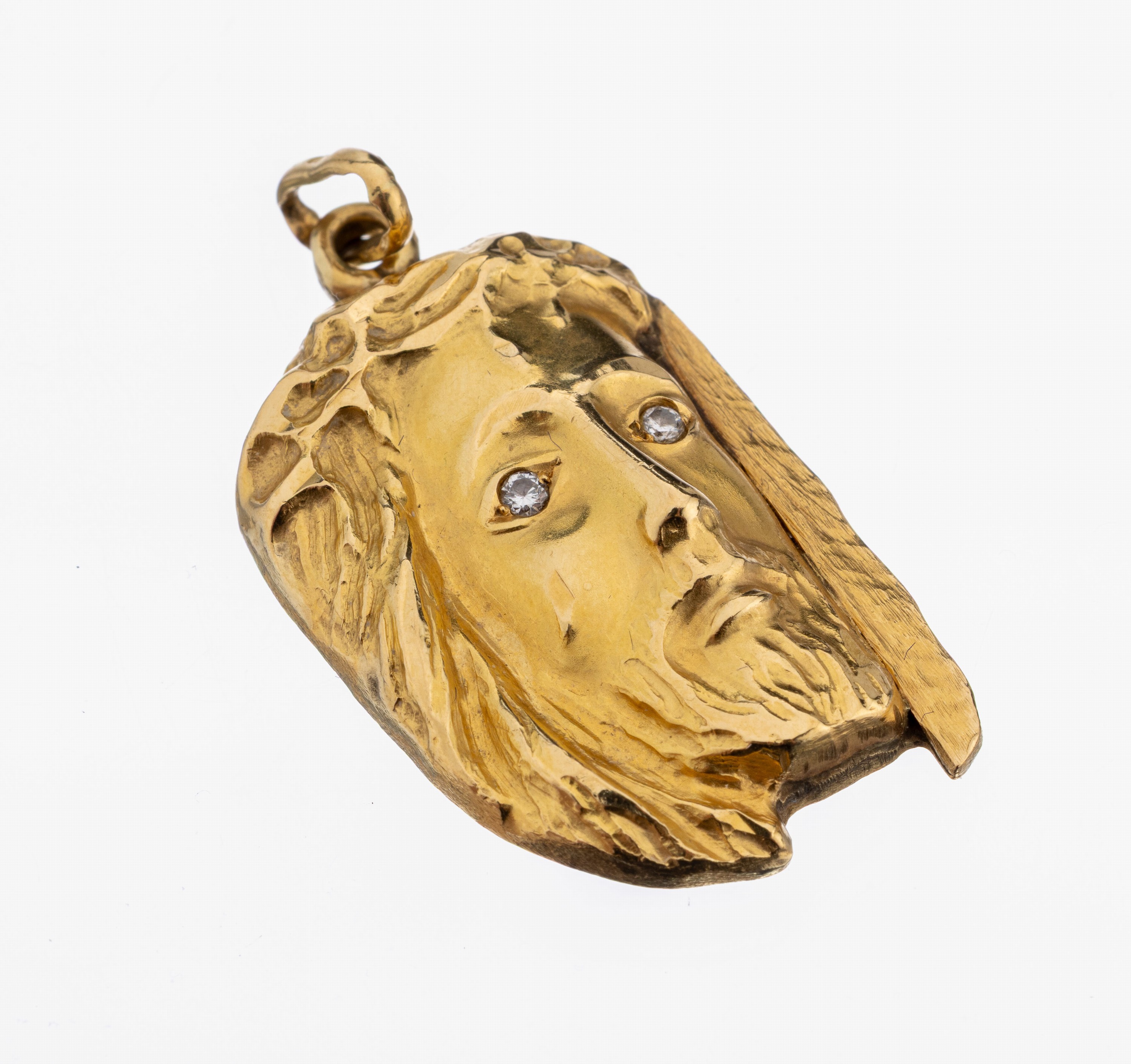 18 kt Gold Brillant-Anhänger, GG 750/000, hohl gearbeitet, Darstellung Jesus Christus, Augen 2 kl. Brillanten, ca. 4.5 x 2.2 cm, ca. 9.0 g, rs. ...
