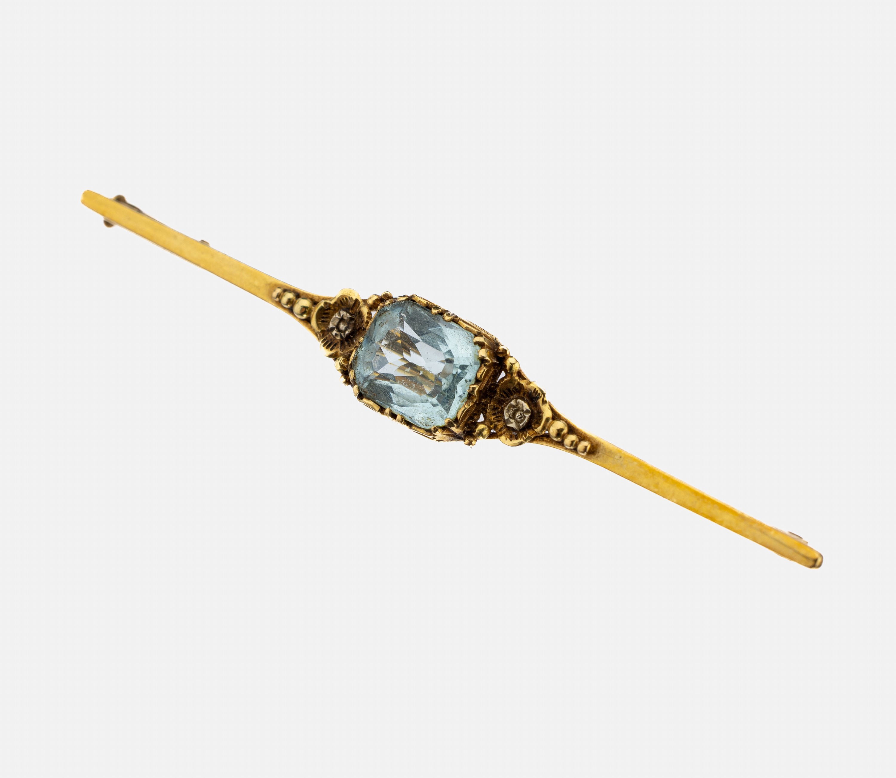 14 kt Gold Farbstein-Brosche, 1930er Jahre, GG 585/000, länglich, facett. synth. Spinell, florale Elemente, L. ca. 6 cm, ca. 3.7 g