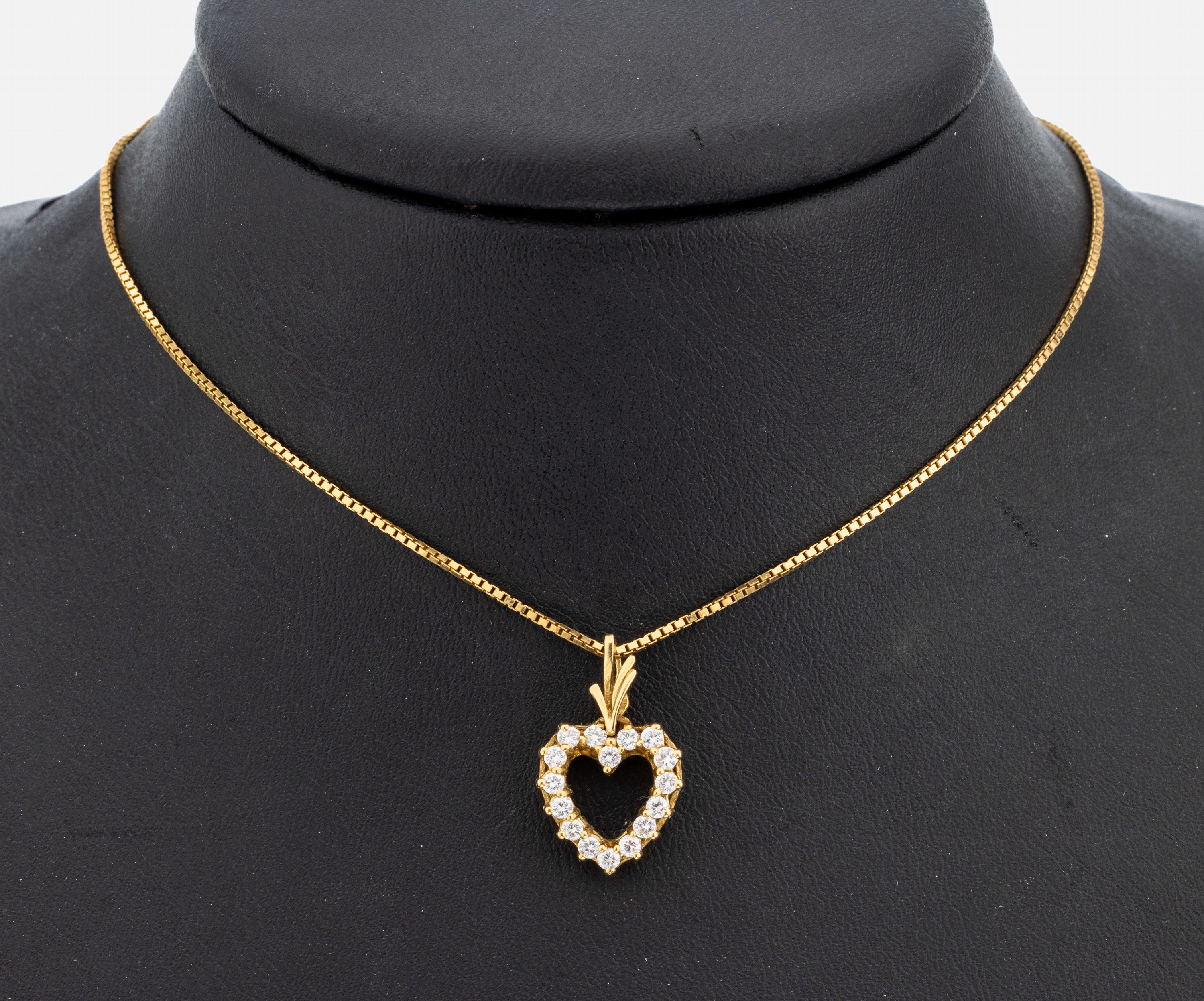 18 kt Gold Brillant-Anhänger "Herz", GG 750/000, 16 Brillanten zus. ca. 0.49 ct feinesWeiß/vs, an Kette, GG 585/000, L. ca. 42 cm, ...