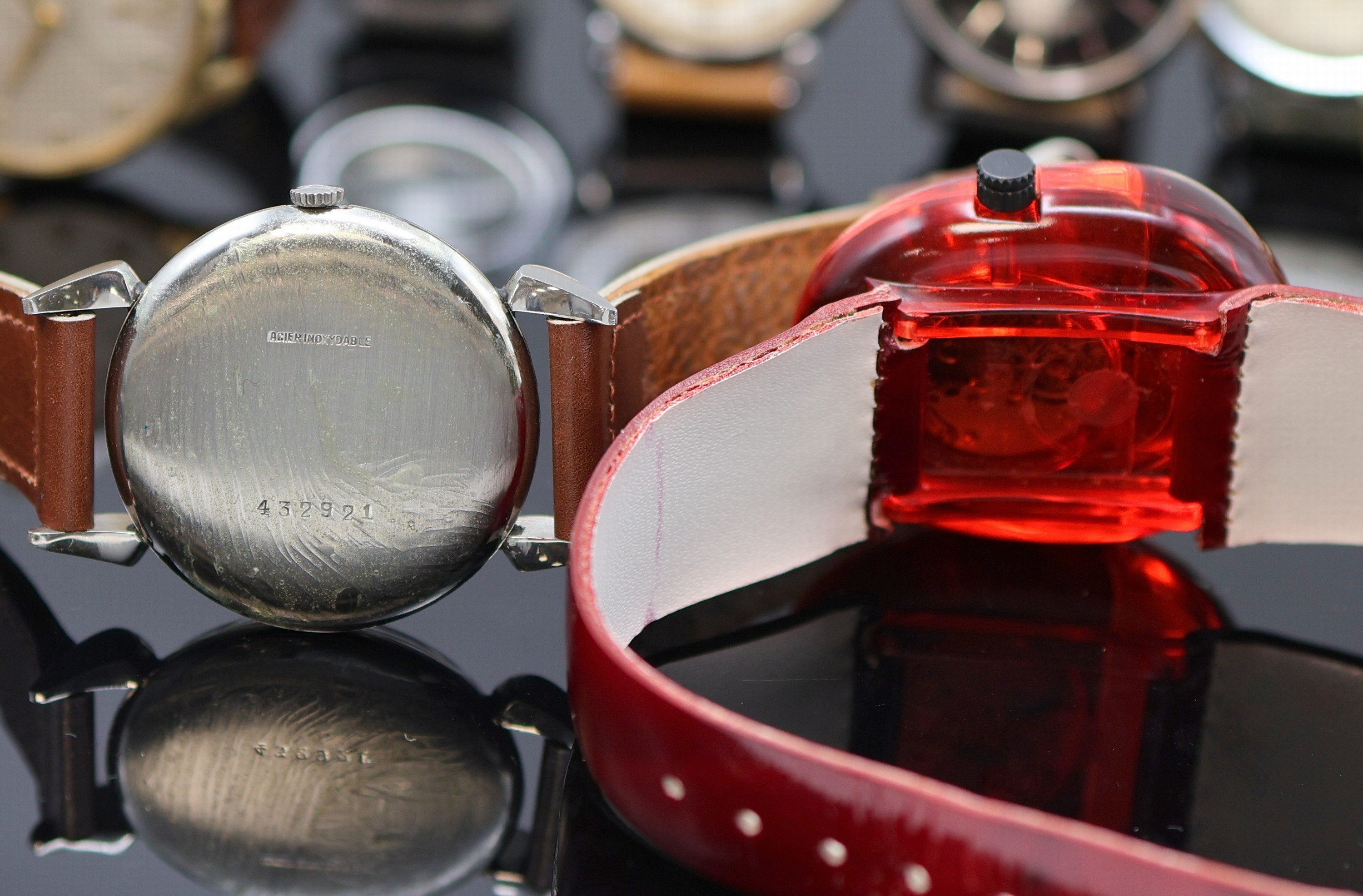 Detail e: Konvolut: 8 teils außergewöhnlichen Armbanduhren, Schweiz um 1938-1975, Handaufzug/Automatik, Geh. 2x Stahl, 2x verg. m. Stahlboden, 3x verschr., ...