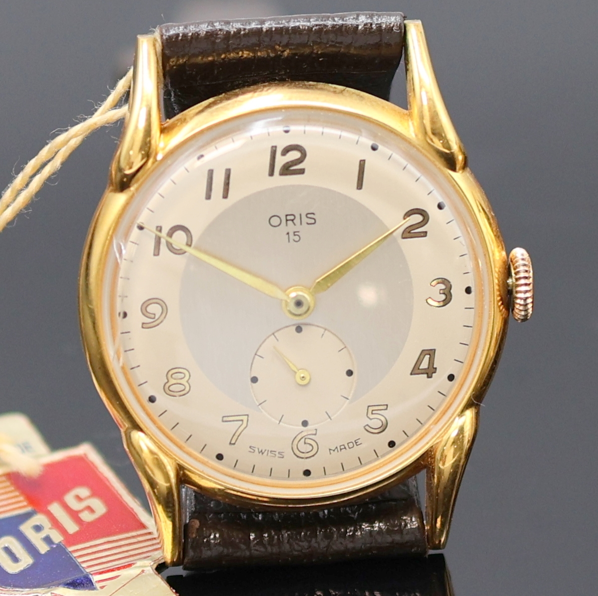 Detail a: ORIS und BUCHERER 2 Armbanduhren, Schweiz 1950er Jahre, Handaufzug, verg. Gehäuse, Böden aufgedr., silb. Zifferblätter, arab. Zahlen u. gebl. ...