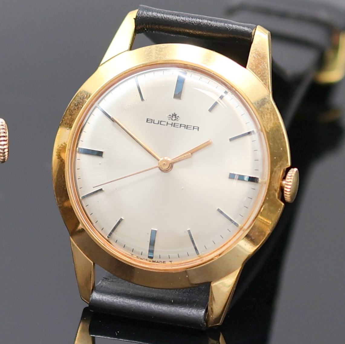 Detail b: ORIS und BUCHERER 2 Armbanduhren, Schweiz 1950er Jahre, Handaufzug, verg. Gehäuse, Böden aufgedr., silb. Zifferblätter, arab. Zahlen u. gebl. ...