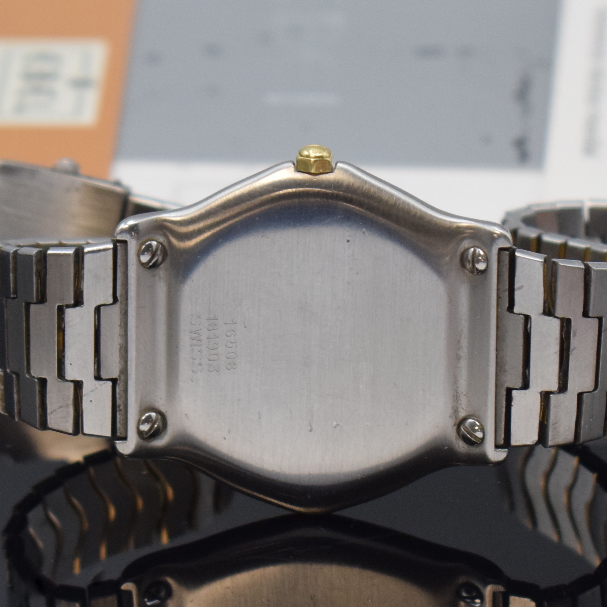 Detail d: EBEL Classic Wave Armbanduhr in Stahl/Gold Referenz 181903, Schweiz um 1990, quarz, 5- fach über Lünette verschr. Geh., orig. Wellenband, weißes ...