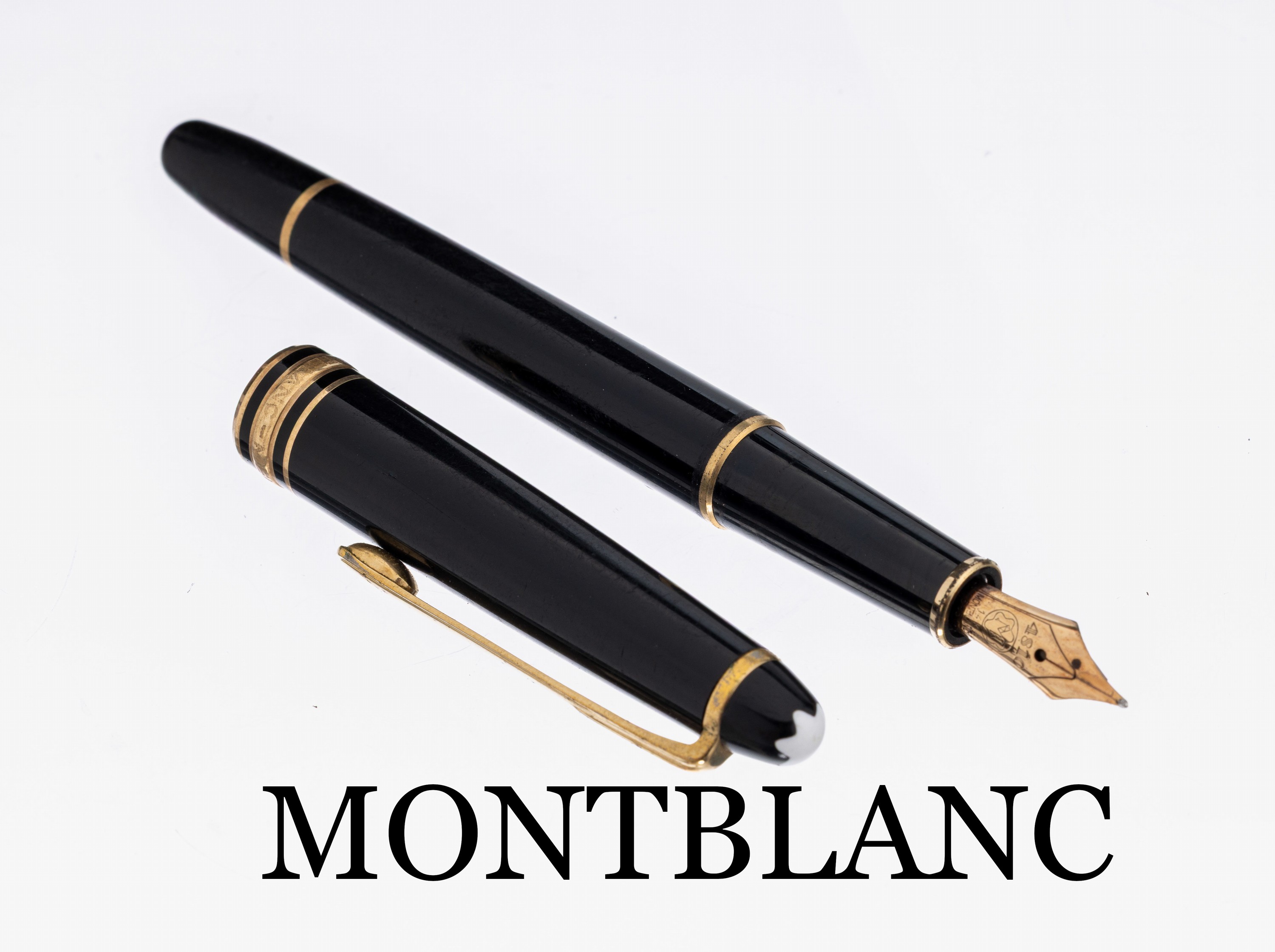 MONTBLANC Füller, Meisterstück, schwarzer Edelharz, Monturen Metall verg., Feder GG 585/000, Stärke M, L. ca. 13.5 cm, starke Gebr.-Spuren