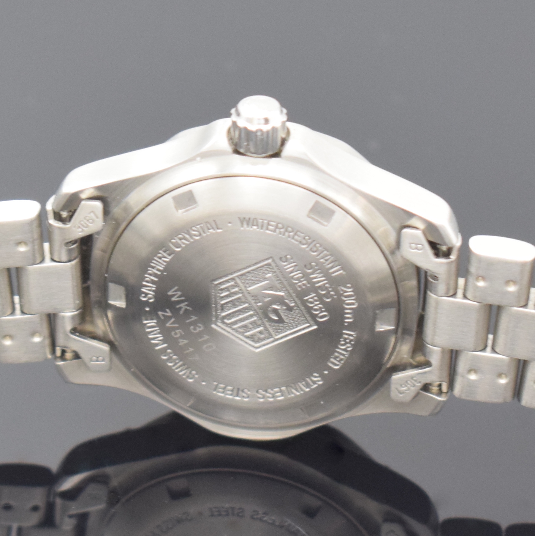 Detail e: TAG HEUER Damenarmbanduhr Referenz WK1310-0,Schweiz um 1995, quarz, Boden u. Krone verschr., orig. Stahlband m. Faltschl., Lünette eins. drehb., ...