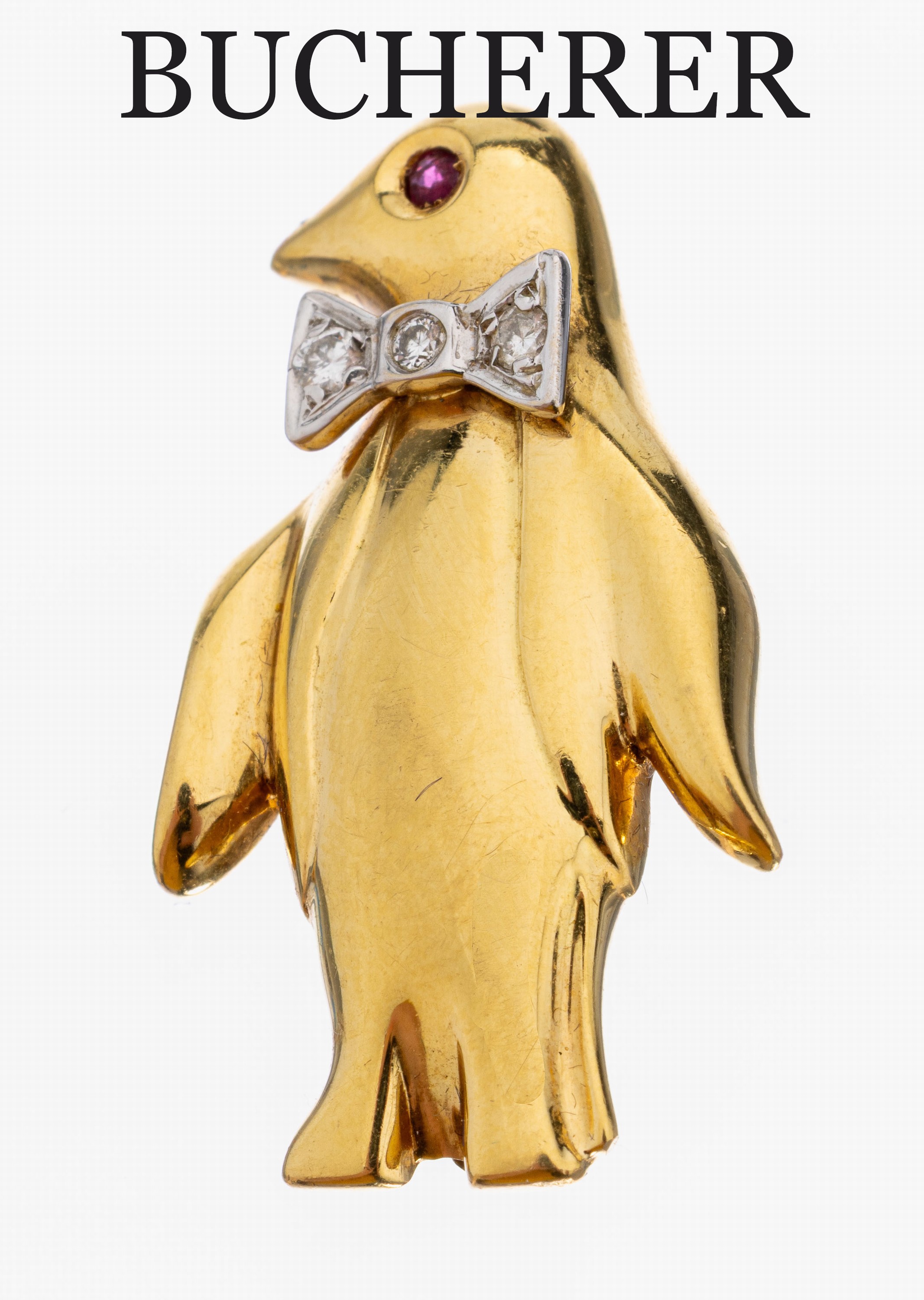18 kt Gold BUCHERER Diamant-Rubin-Brosche, "Pinguin", GG/WG 750/000, Auge bes. mit einem rundfacett. Rubin, Schleife in WG bes. mit 3 ...