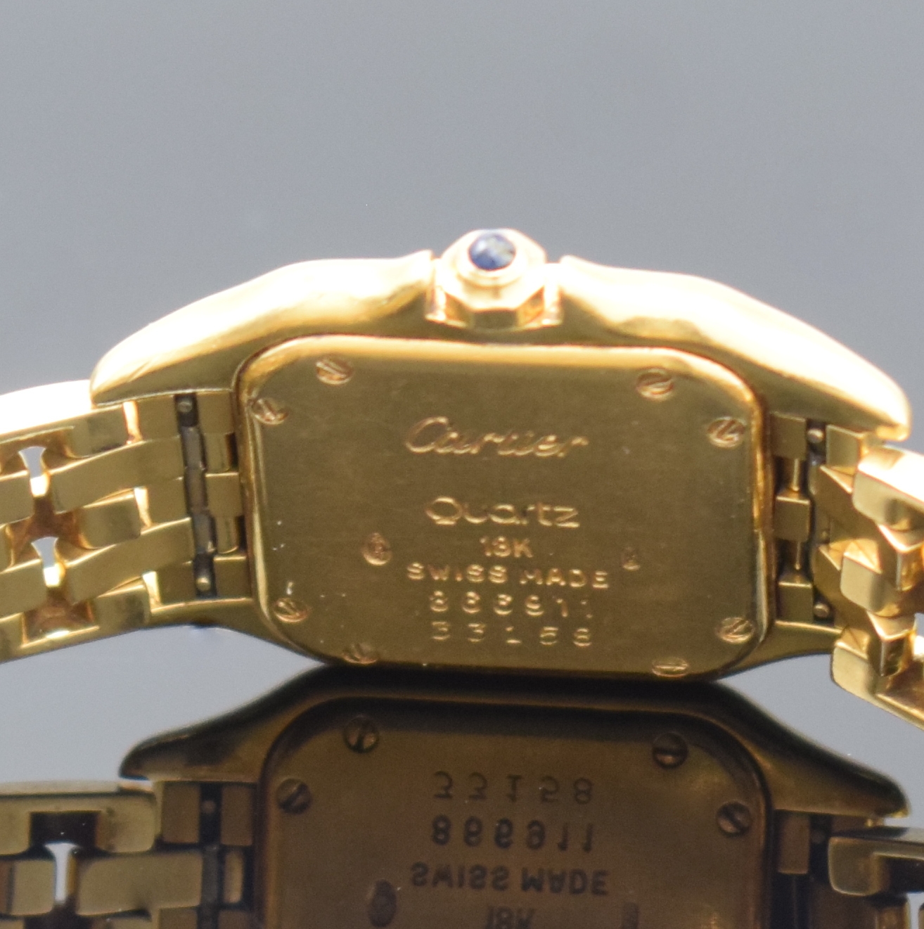 Detail c: CARTIER Damenarmbanduhr in GG 750/000 Referenz 866911 Schweiz um 1985, quarz, Boden 8-fach verschr., Schmuckkrone, orig. Gliederband m. dopp. ...