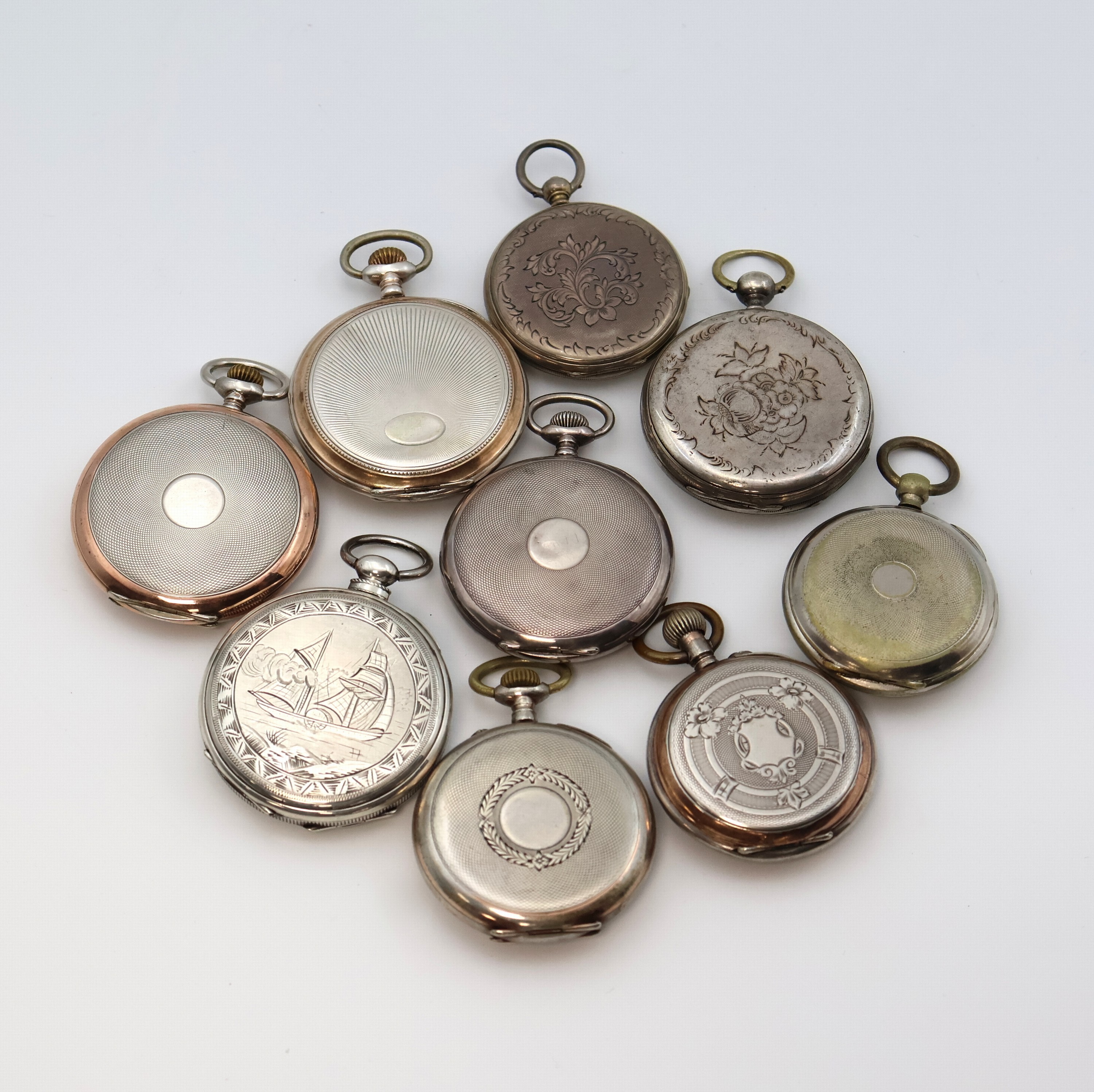 Detail c: Konvolut: 9 offene Taschenuhren, Schweiz um 1860-1920, 8 teils schön grav. Geh. berieben/dell., 1x Nickel, Emailzifferbl. m. röm./arab. Zahlen, ...