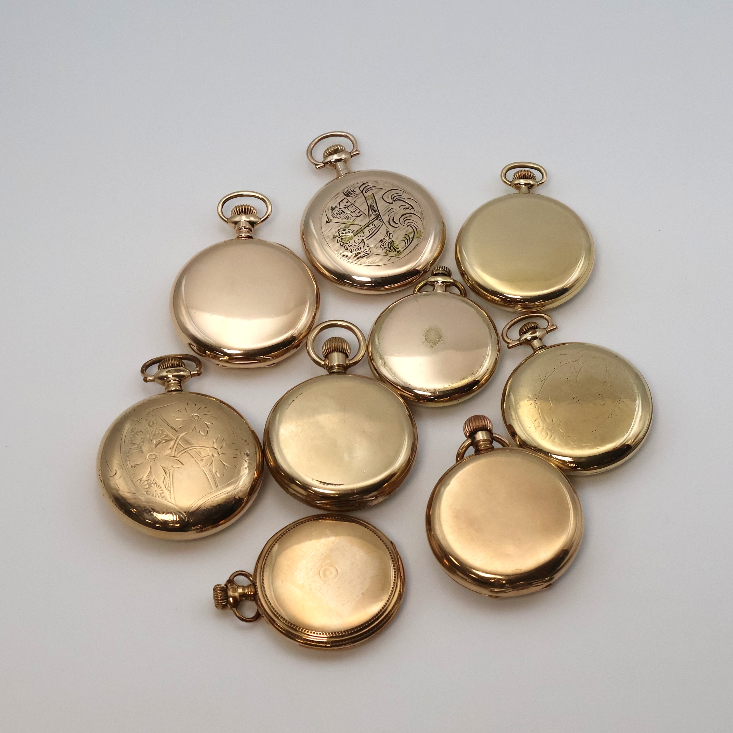 Detail c: Konvolut: 9 amerikanische vergoldete Taschenuhren, USA um 1900-1920, offene Geh., Kronenaufzug, 5x beids. verschr., Emailzifferblätter teils besch., ...