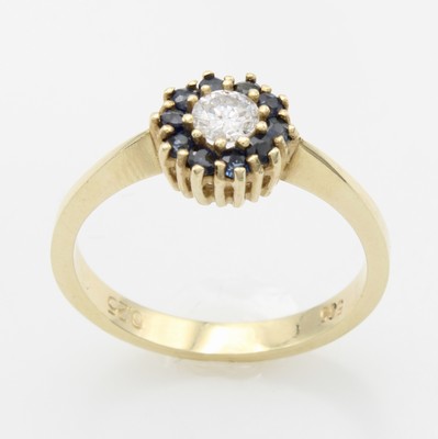 26918597a - Ring mit Brillant und Saphiren, GG 585/000, Brill. ca. 0.25 ct Weiß/p umfasst v. ...