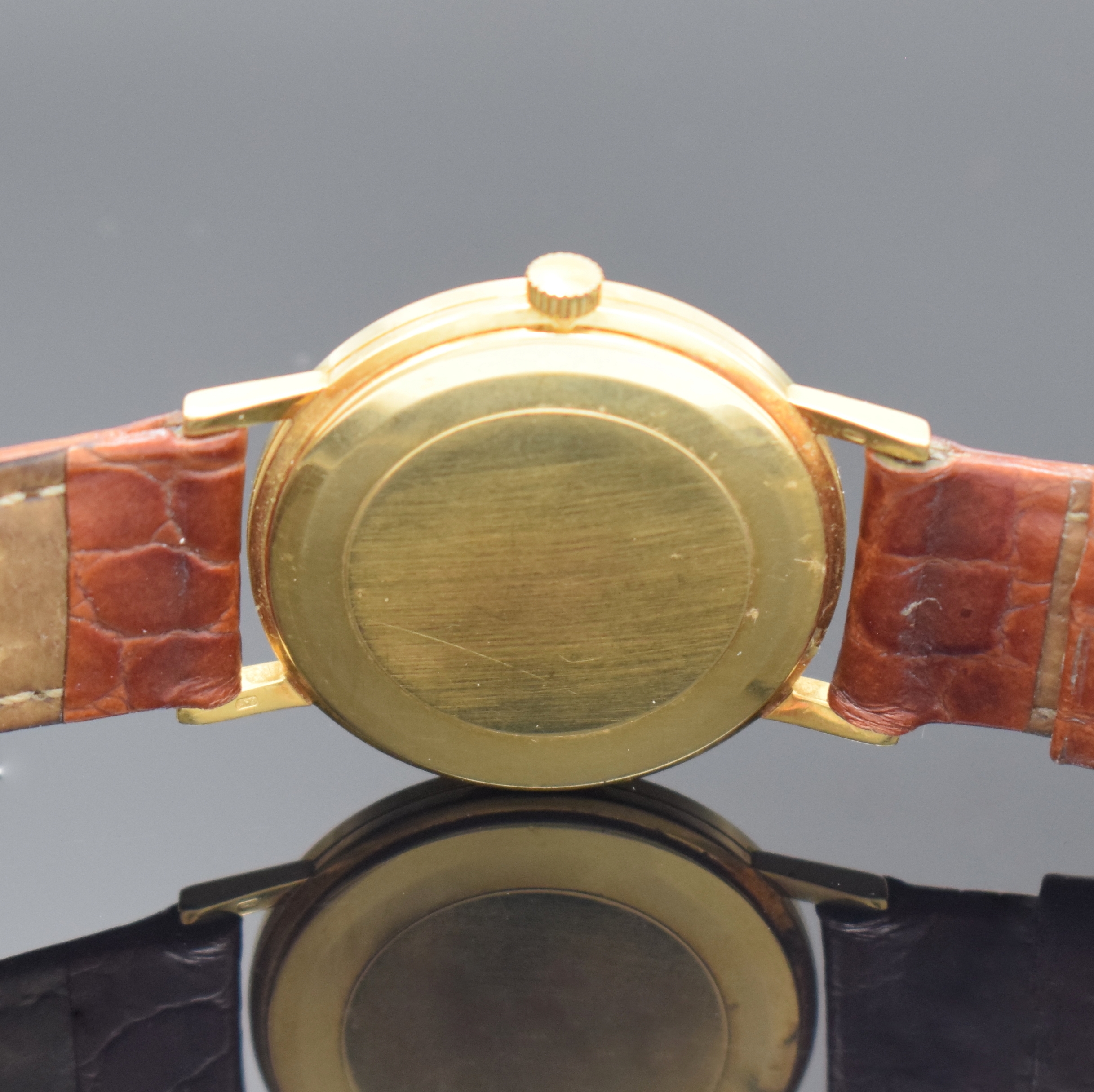 Detail c: OMEGA Armbanduhr Referenz 14731 in GG 750/000, Schweiz um 1969, Handaufzug, 3-tlg. Geh., Boden u. Glasrand aufgedr., gold. Zifferbl. m. aufges. gold. ...