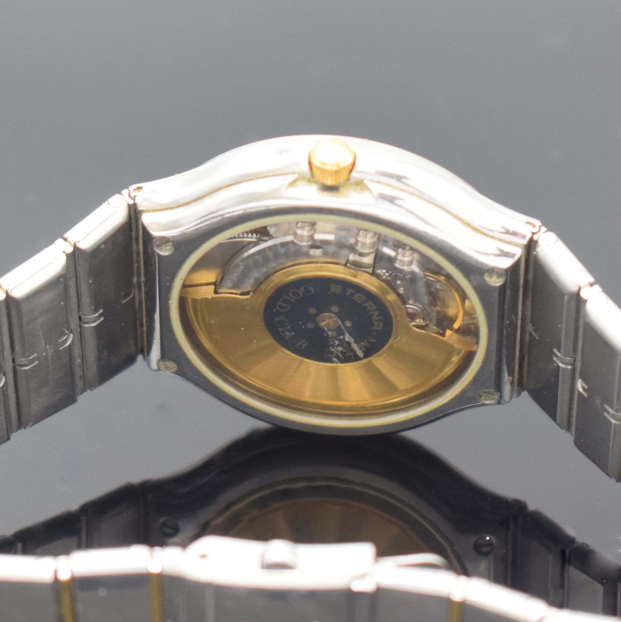 Detail d: ETERNA-MATIC Gold-Club Armbanduhr in Stahl/ Gold, Schweiz um 1990, Automatik, beids. vergl. Geh., Goldlünette m. blauen Einlagen, integr. ...