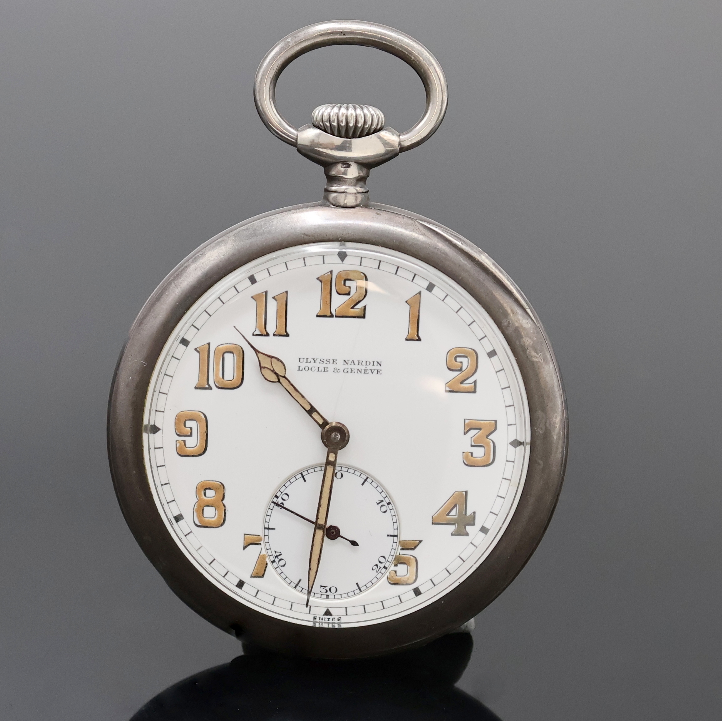 ULYSSE NARDIN offene Silbertaschenuhr, Schweiz um 1920, geschw. Silbergeh., sign. Silbercuvette, 2-tlg. Emailzifferbl. riss./besch., Leuchtzahlen u. ...