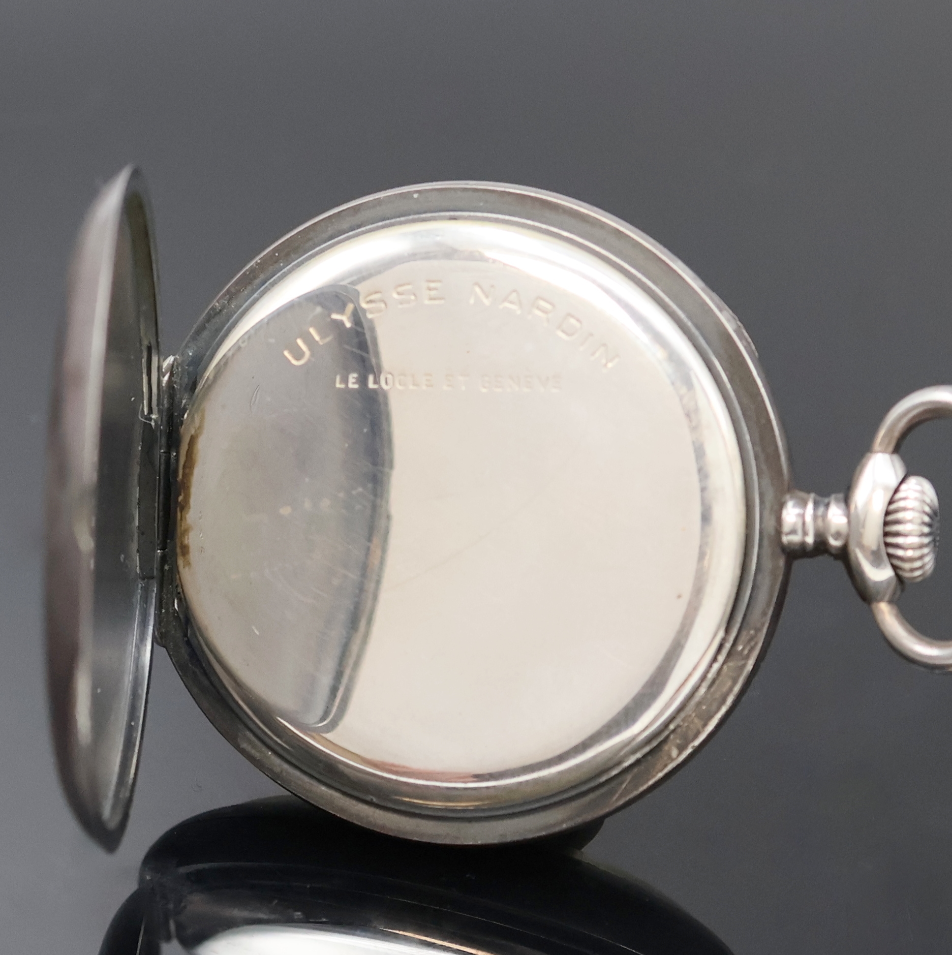 Detail b: ULYSSE NARDIN offene Silbertaschenuhr, Schweiz um 1920, geschw. Silbergeh., sign. Silbercuvette, 2-tlg. Emailzifferbl. riss./besch., Leuchtzahlen u. ...