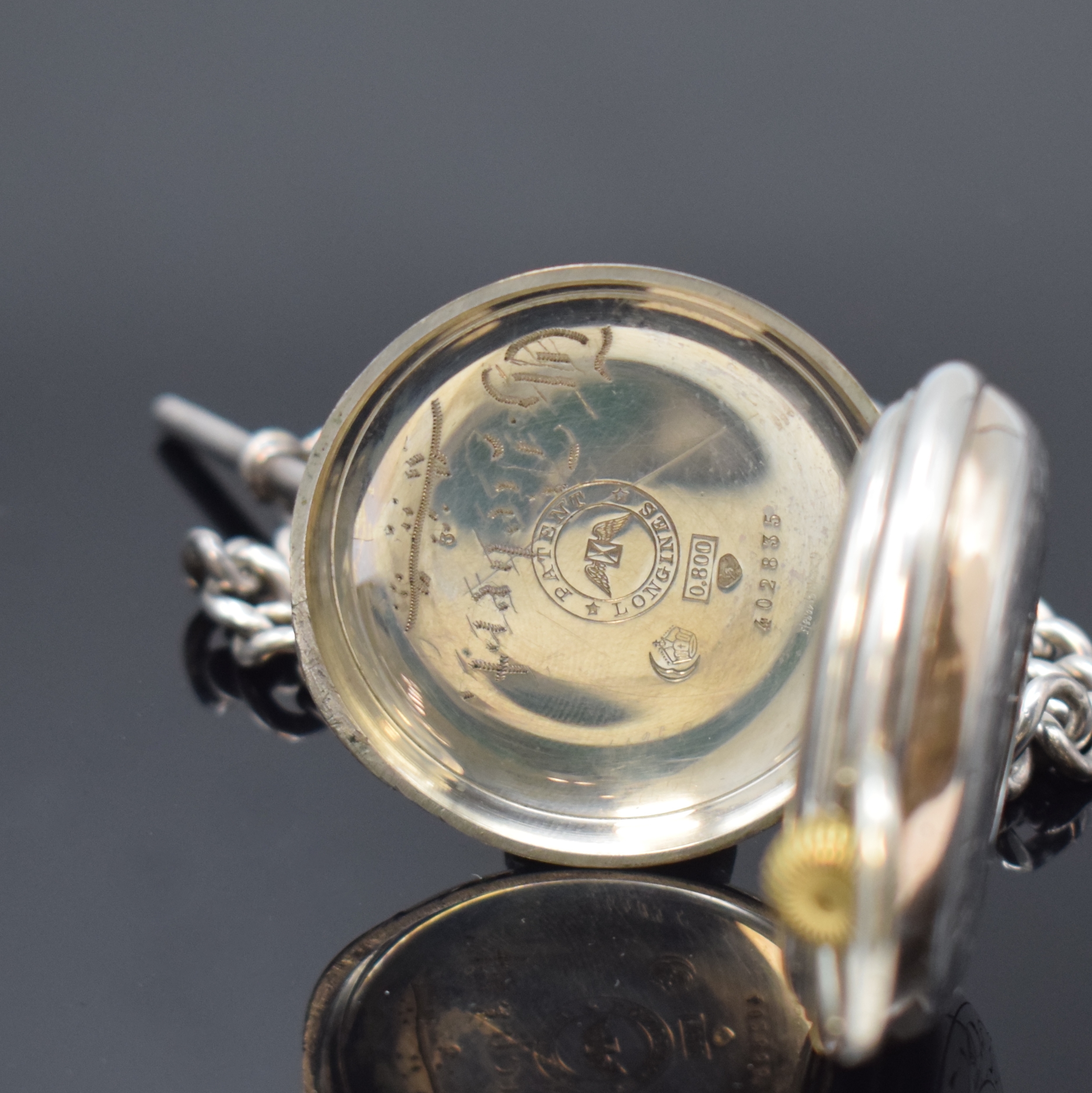 Detail d: LONGINES frühe Halbsavonette in Silber an schwerer Sterling-Silberkette, Schweiz um 1885, floral grav. Geh., sign., teil-guill. Cuvette, Innenseite ...