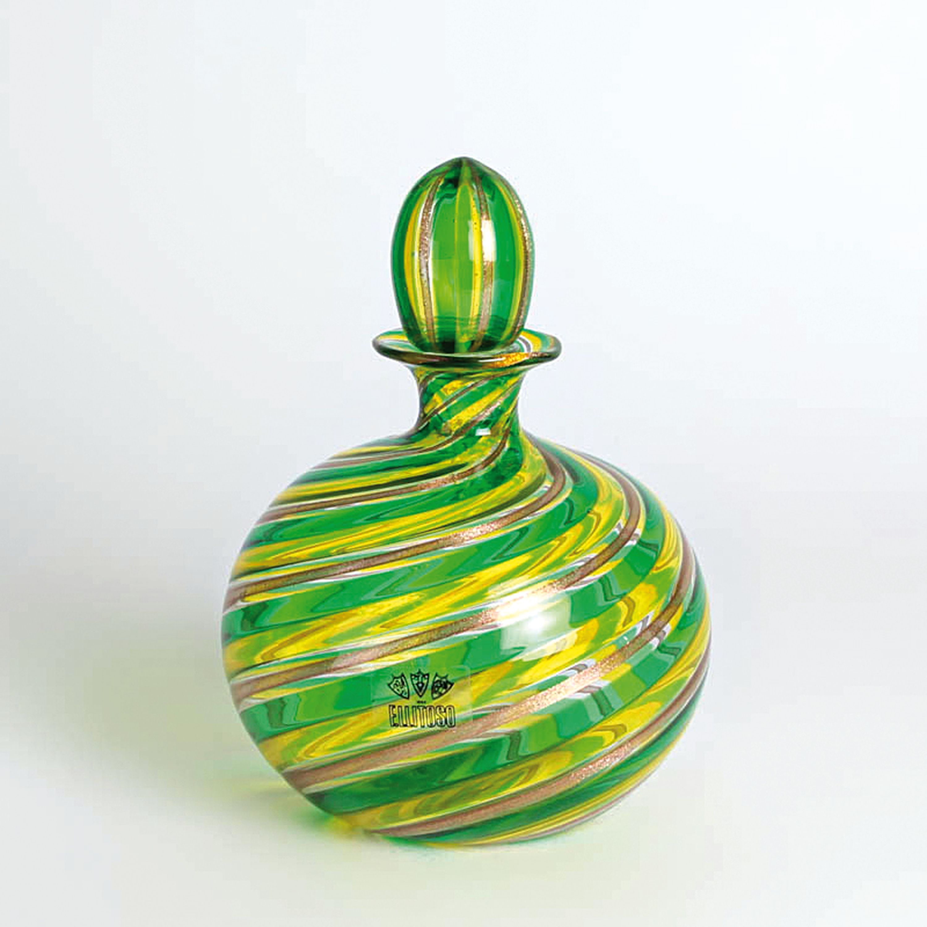 a Canne-Flakon, Fratelli Toso, Murano, 1960-70, farbloses Glas, gelb-grüne Faden- sowie Kupferpulvereinschmelzungen, mit Stopfen, Herstelleretikett, ...