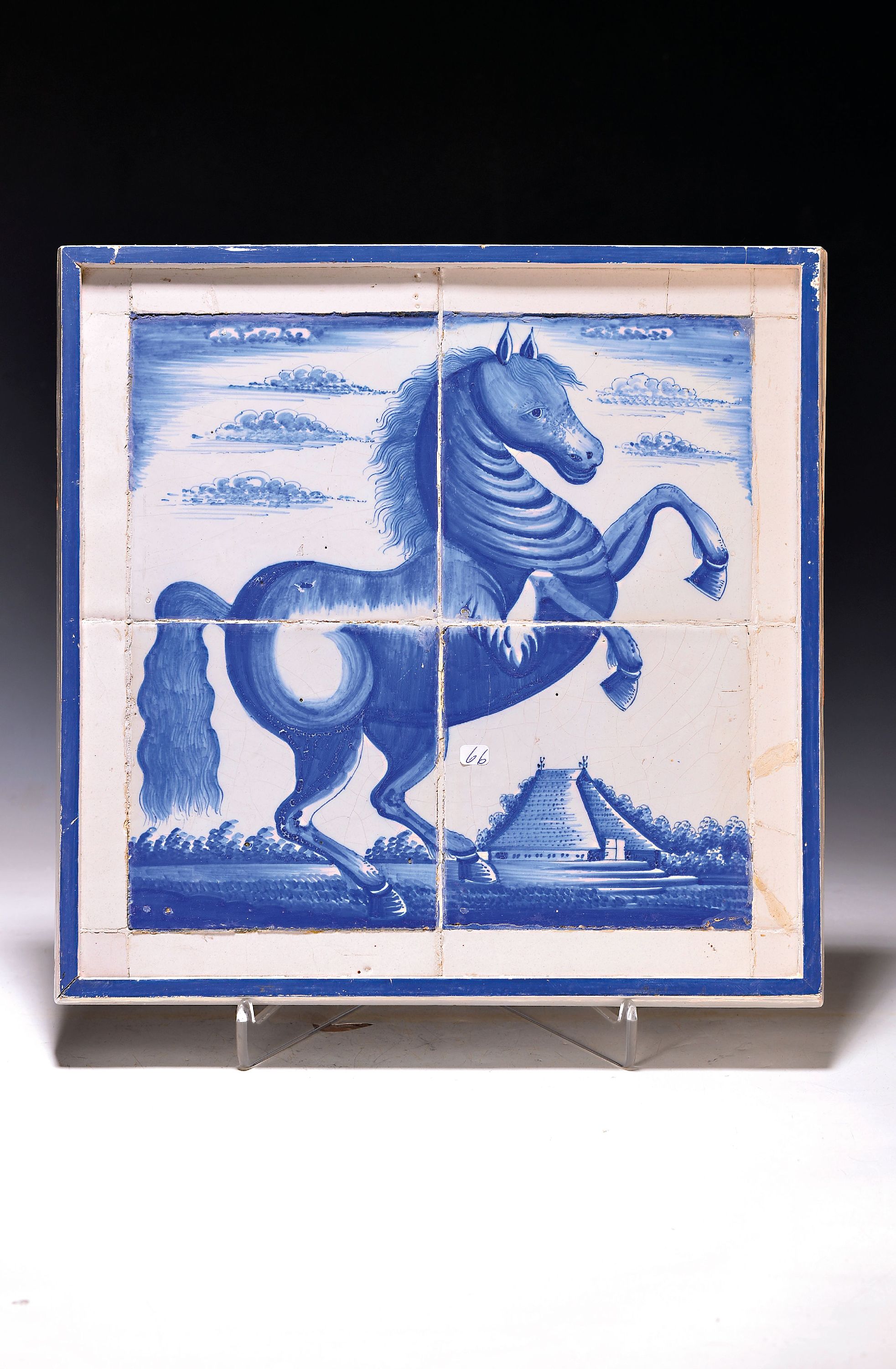 Kachelbild, wohl Ansbach um 1725-30, steigendes Pferd vor stil. Landschaft, blaue Bemalung, altersbedingt beschädigt bzw. restauriert, vier bemalte ...