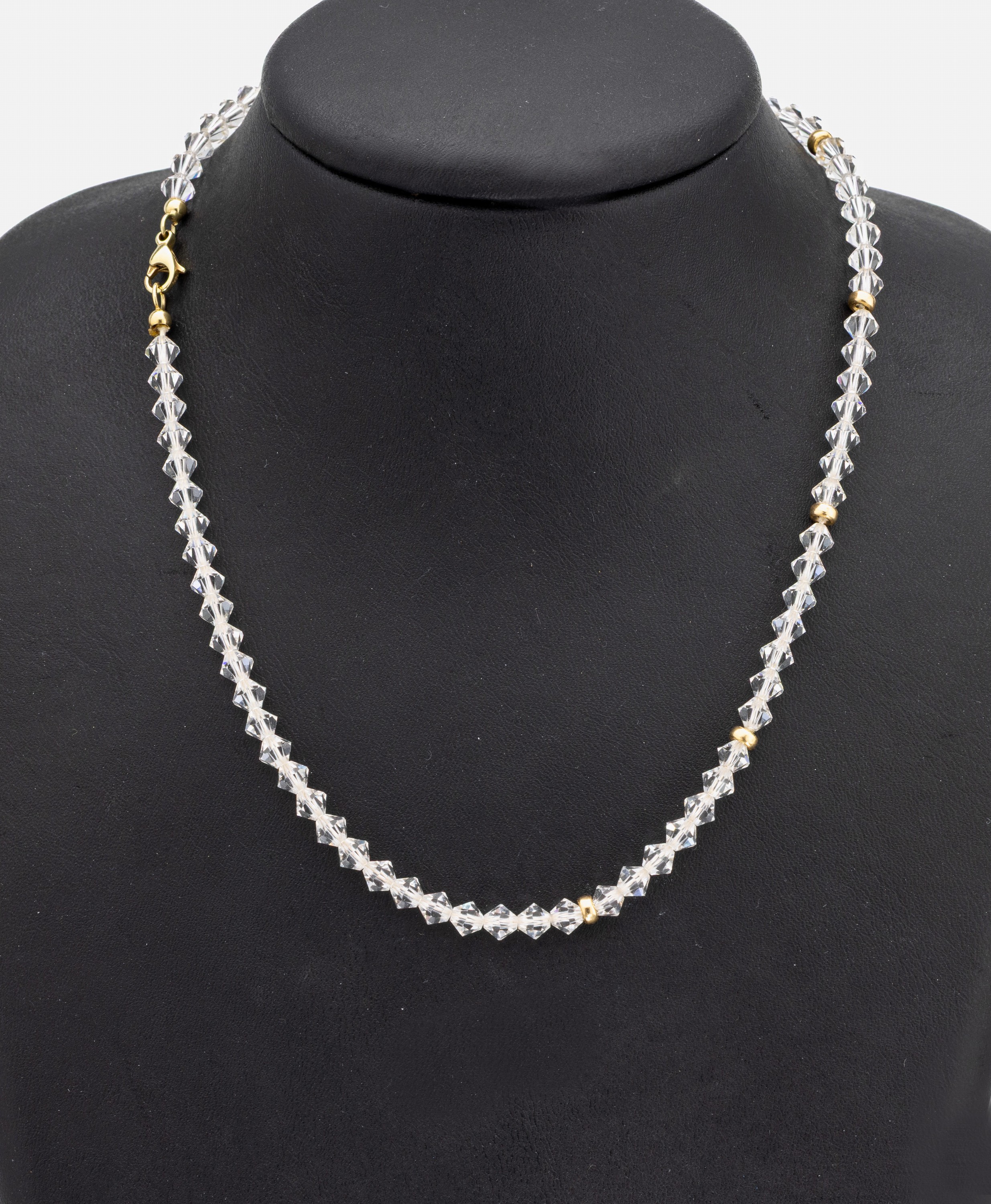 14 kt Gold Bergkristall-Collier, Idar-Oberstein um 1900, GG 585/000, Karabinerschließe und Zwischenrondelle GG, facett. Bergkristall, L. ca. 41 cm