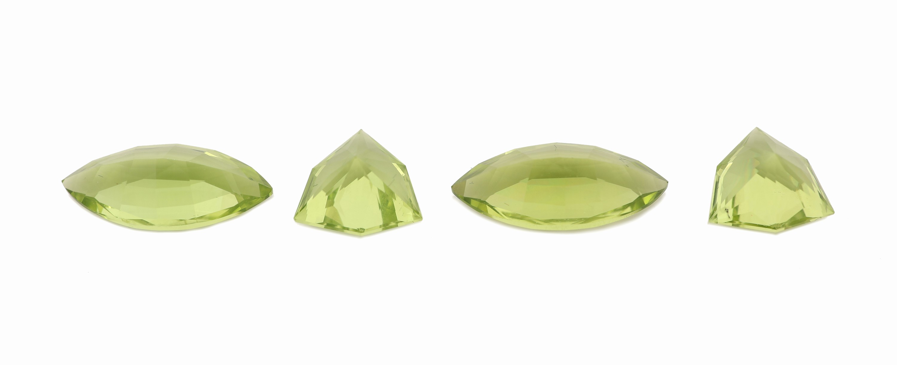 Detail a: Lot 4 Peridots, zus. ca. 6.96 ct, 1 x 2 facett. Navettes zus. ca. 4.22 ct; 1 x 2 facett. Triangel zus. ca. 2.74 ct
