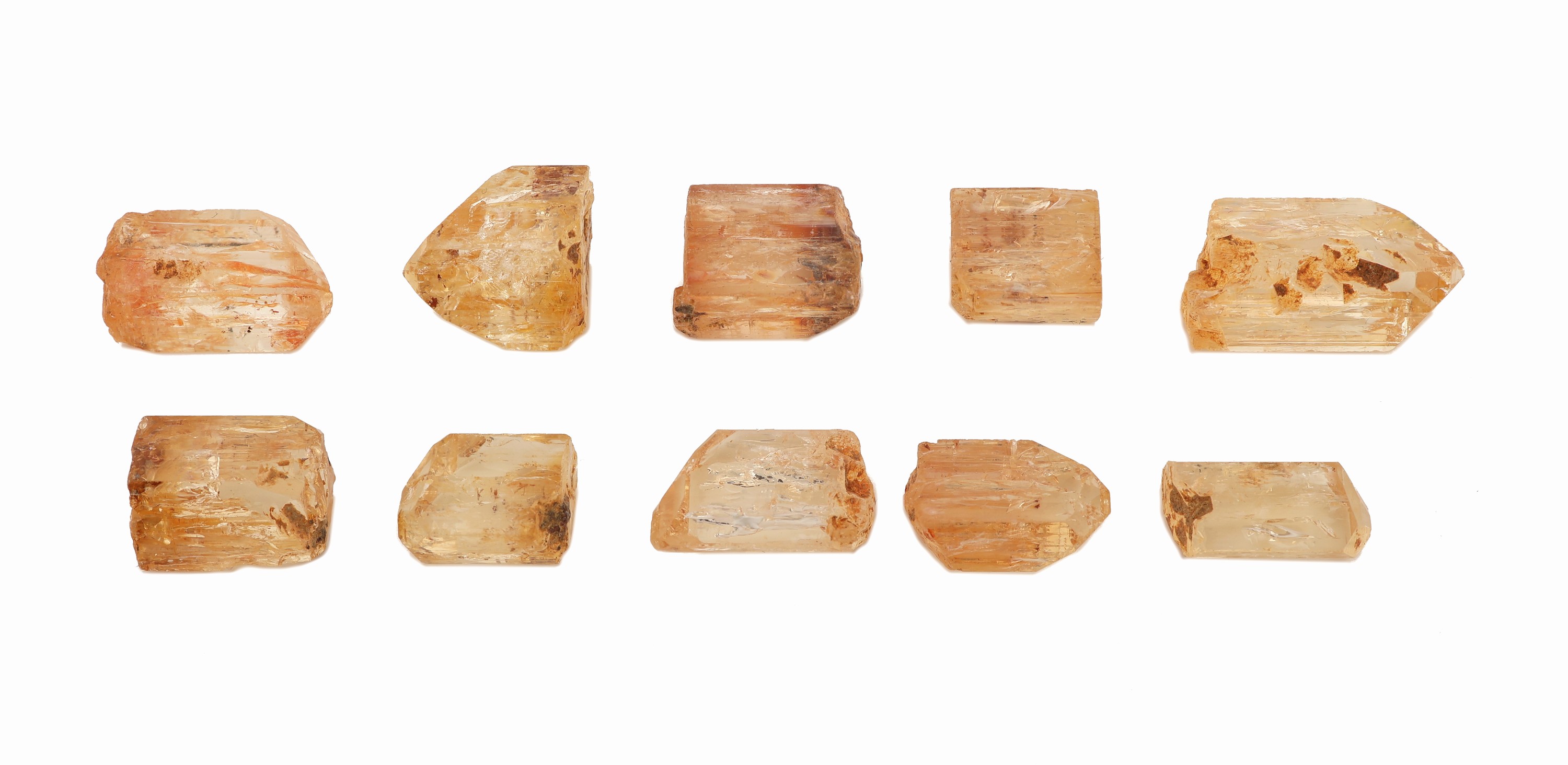 Lot 10 lose Imperialtopas-Rohsteine, zus. ca. 98.81 ct, versch. Größen, Formen und Farbnuancen