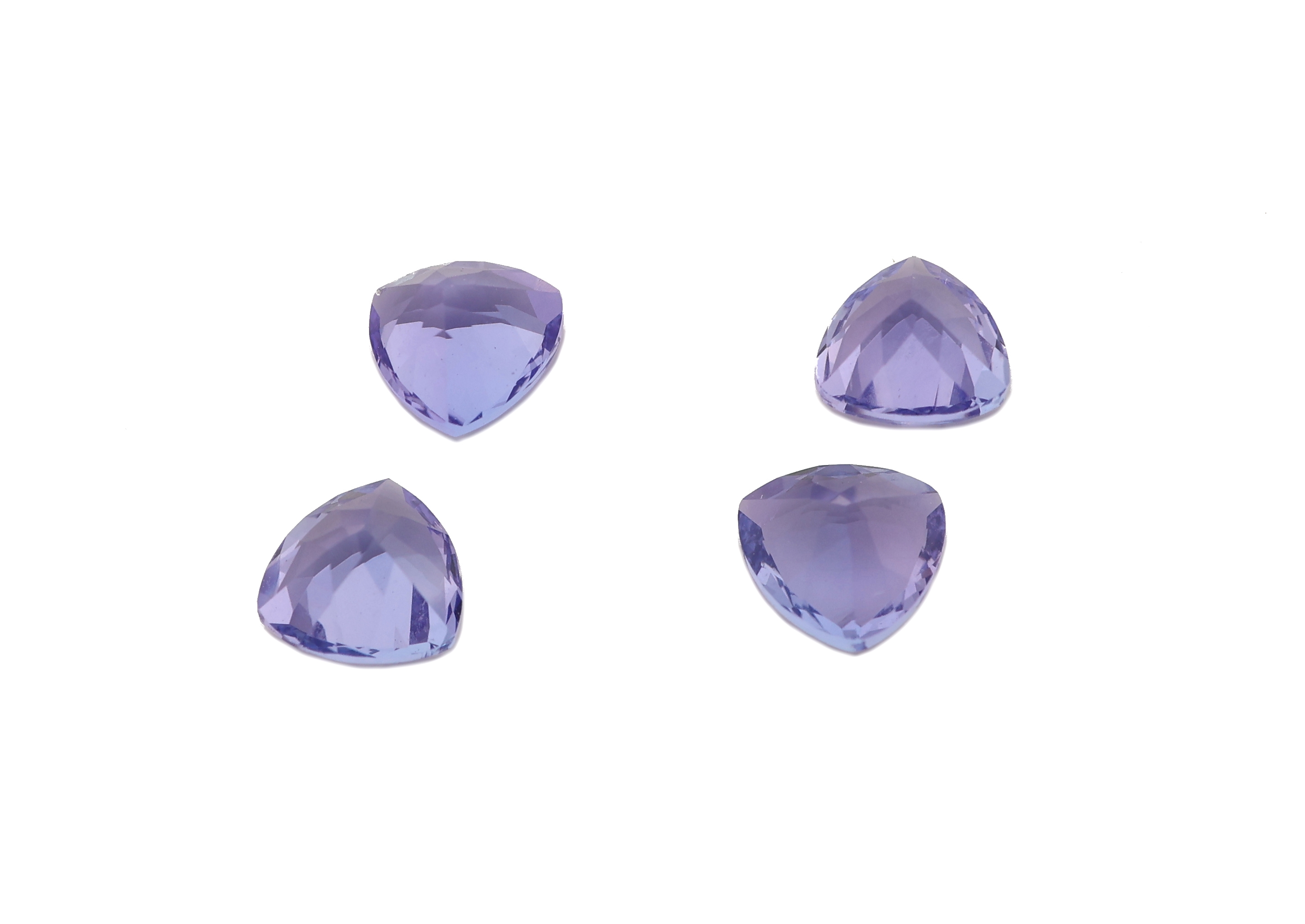 Detail a: Lot 4 lose Tansanite, zus. ca. 1.16 ct, facett. Triangeln, sehr schöne Farbe