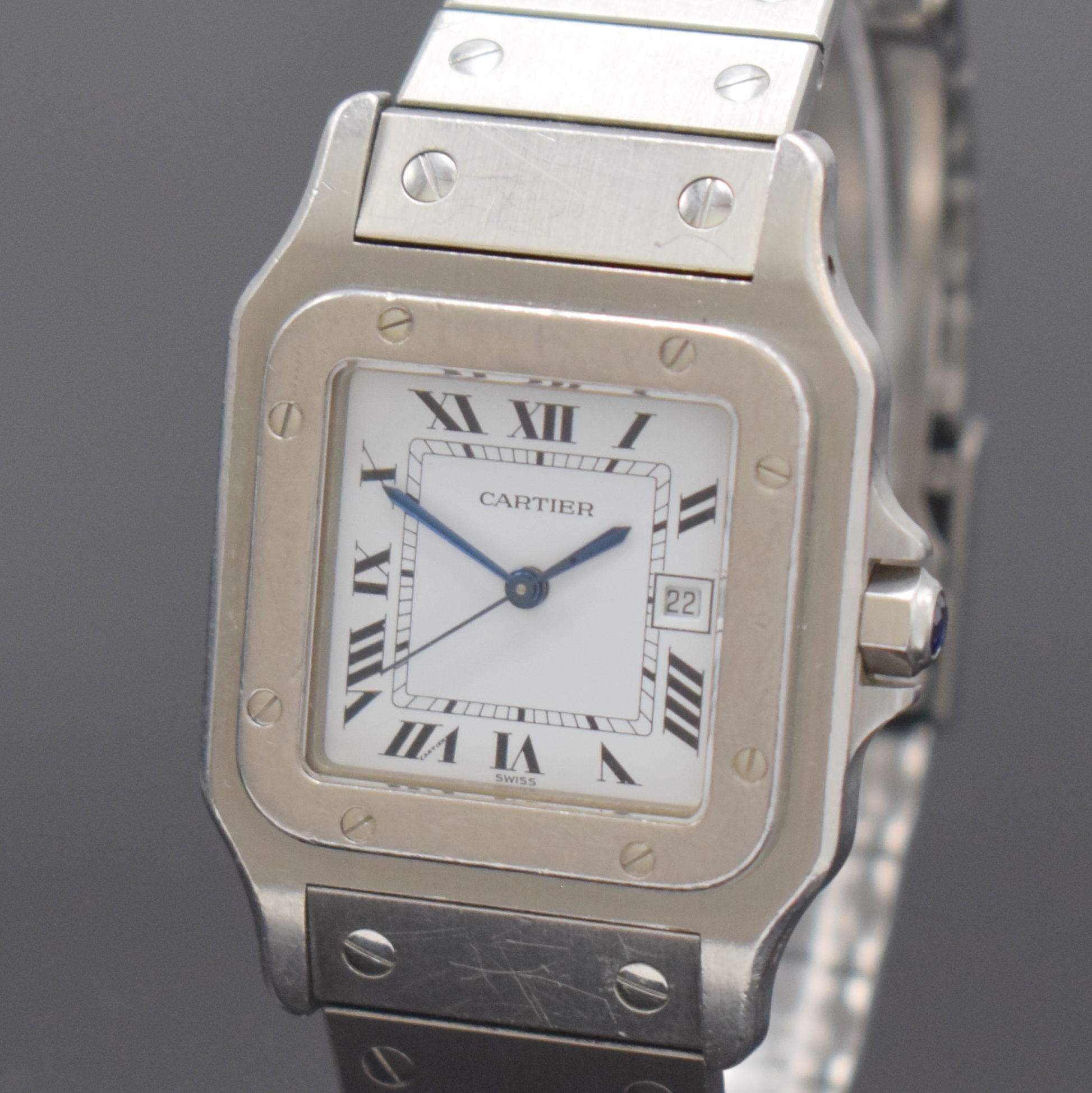 Detail a: CARTIER Santos Armbanduhr in Stahl, Schweiz um 1985, Automatik, 8-fach über Lünette verschr. Geh. inkl. Gliederband m. Faltschl., Krone m. ...