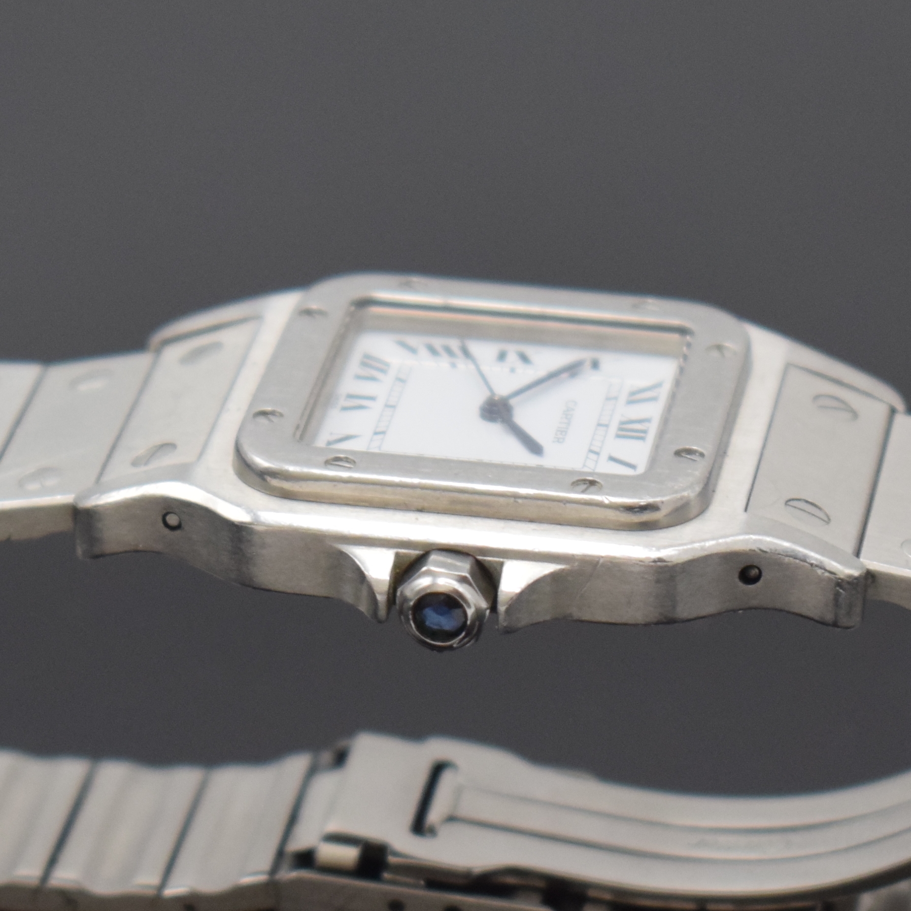 Detail c: CARTIER Santos Armbanduhr in Stahl, Schweiz um 1985, Automatik, 8-fach über Lünette verschr. Geh. inkl. Gliederband m. Faltschl., Krone m. ...