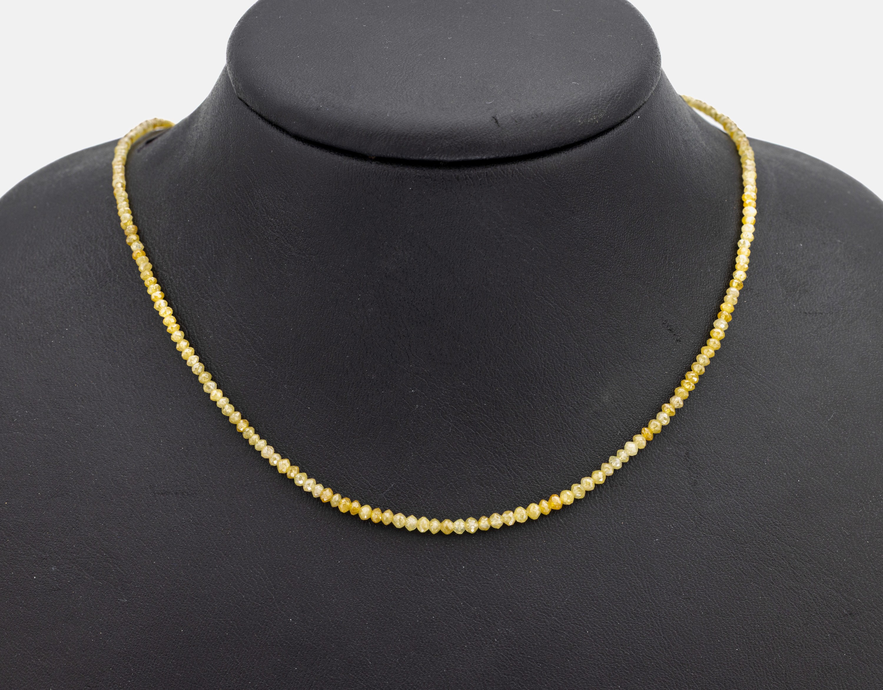 Diamant-Collier mit 14 kt Gold Schließe, GG585/000, facett. Diamanten in versch. Gelbtönen, L. ca. 45 cm, Karabinerschließe