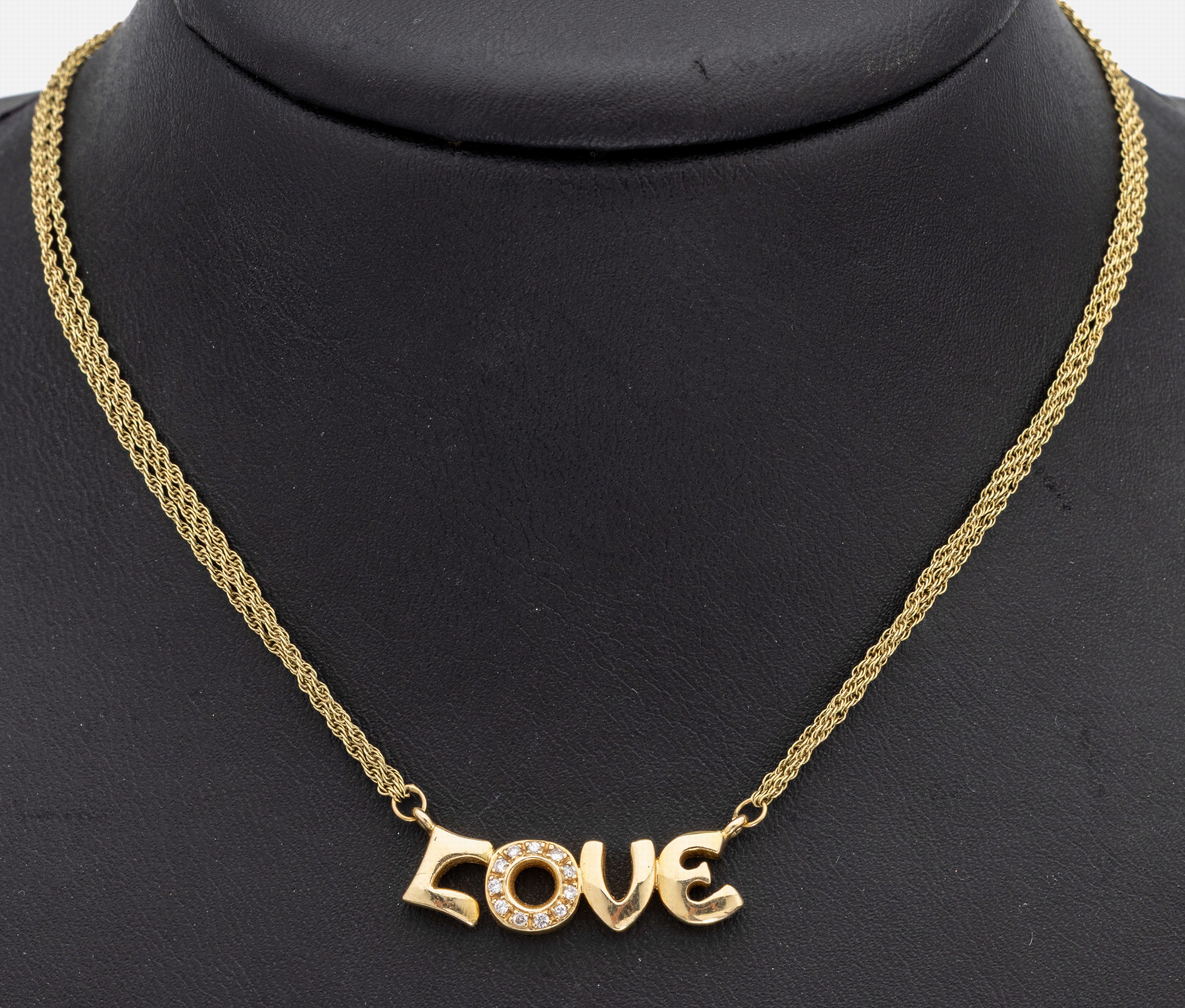 14 kt Gold Brillant-Collier "LOVE", GG 585/000, Mittelteil LOVE, O mit 11 Brillanten zus. ca. 0.10 ct Weiß/si, 3-rhg. Kette, L. ca.44 cm, ...