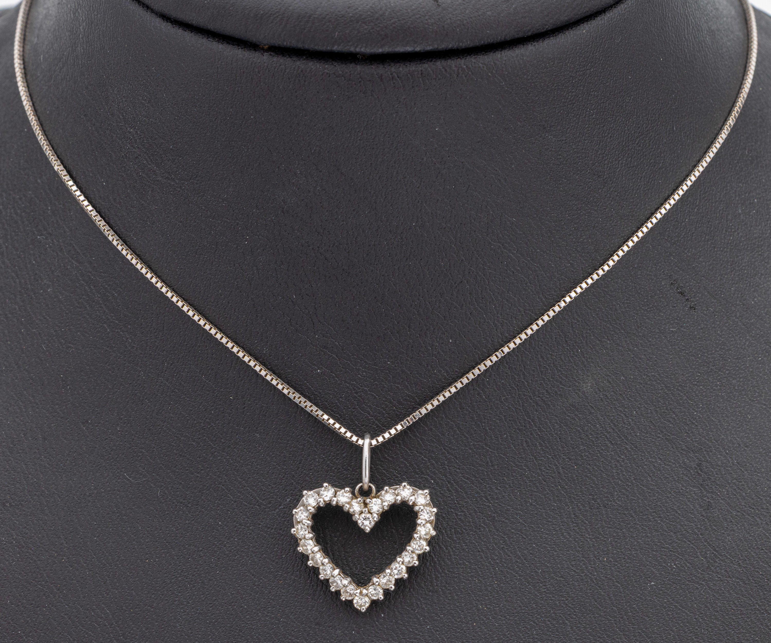 18 kt Gold Diamant Herzanhänger, WG 750/ 000, bes. mit 25 Brillanten zus. ca. 0.50 ct Weiß/p 1, an WG Kette, L. ca. 42 cm, Federringschließe, ca. ...