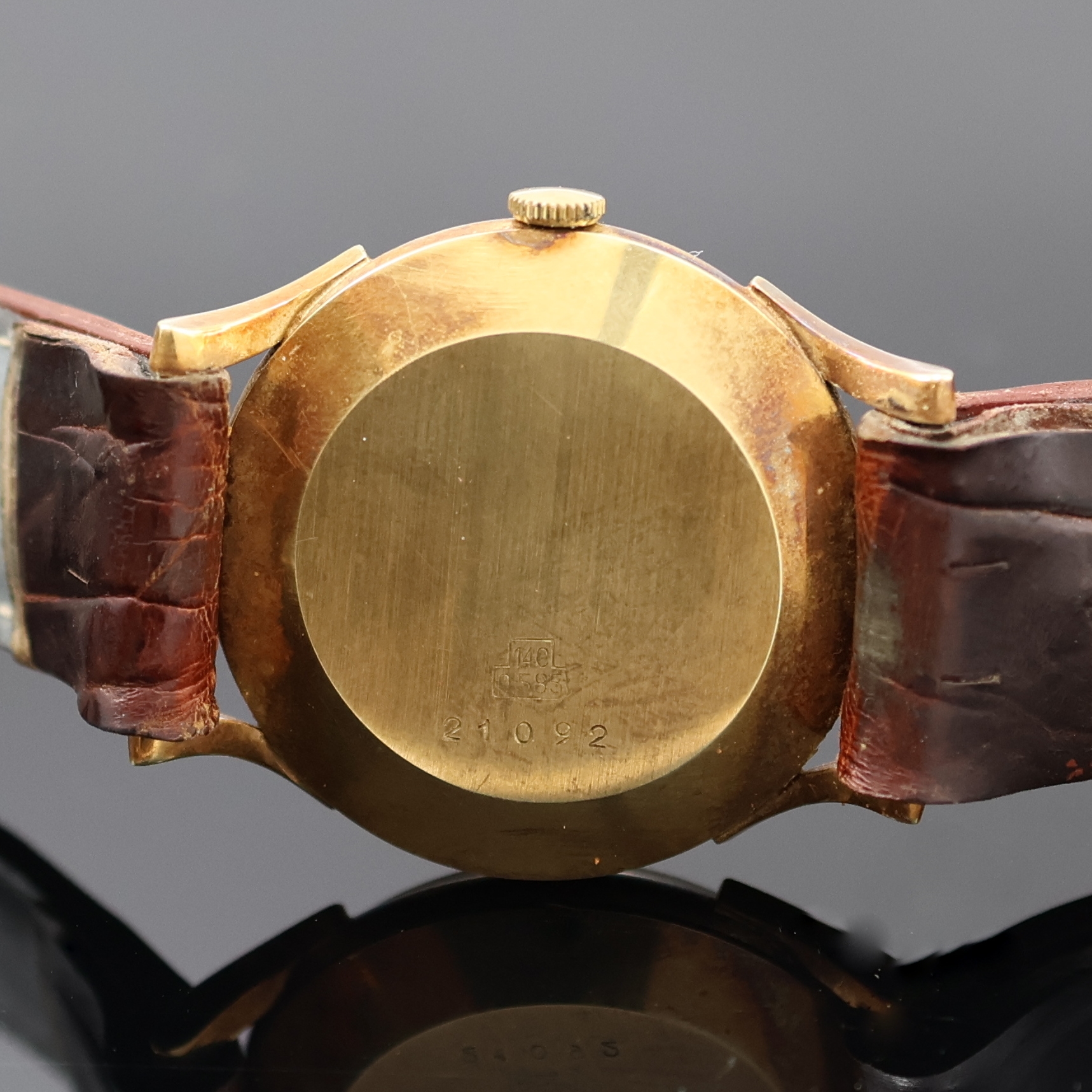 Detail c: STOWA Herrenarmbanduhr in GG 585/000, Schweiz um 1965, Handaufzug, Boden aufgedr., silb./champagnerfarb. Zifferbl. m. aufges. gold. Ind., gold. ...
